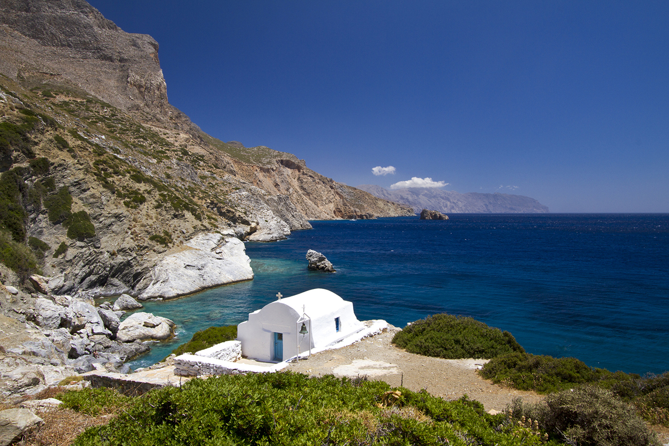 Idyllic coast of Amorgos, in the Cyclades Islands of Greece, with a small chapel guarding the coast.