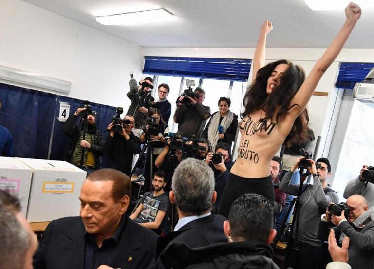 In your face Silvio! Γυμνόστηθη Femen "σόκαρε" τον Μπερλουσκόνι την ώρα που ψήφιζε [pics, vids]