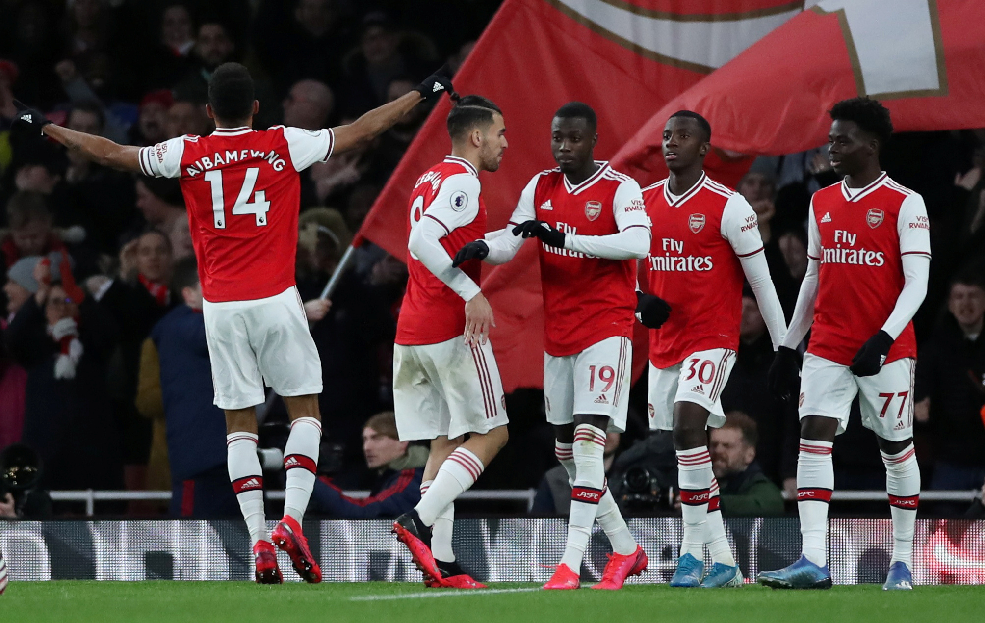 Soccer Football - Premier League - Arsenal v Everton - Emirates Stadium, London, Britain - February 23, 2020  Arsenal's Pierre-Emerick Aubameyang celebrates scoring their third goal with teammates   Action Images via Reuters