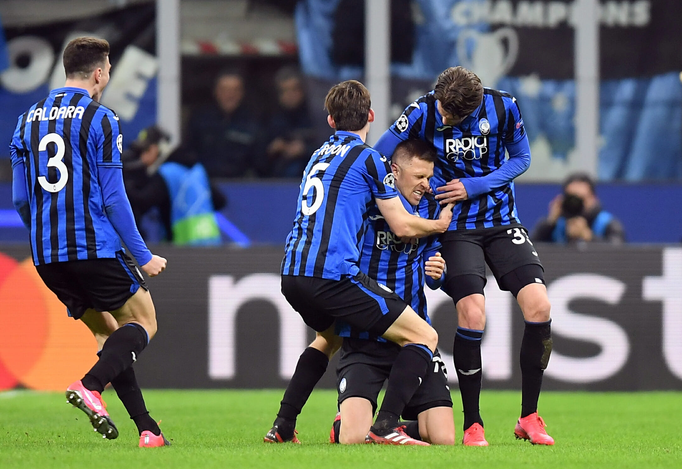 Soccer Football - Champions League - Round of 16 First Leg - Atalanta v Valencia - San Siro, Milan, Italy - February 19, 2020  Atalanta's Josip Ilicic celebrates scoring their second goal with Hans Hateboer and teammates  REUTERS