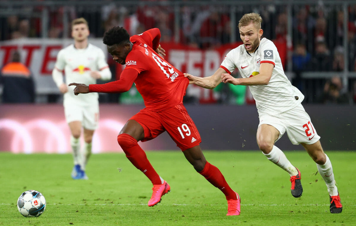 Soccer Football - Bundesliga - Bayern Munich v RB Leipzig - Allianz Arena, Munich, Germany - February 9, 2020  Bayern Munich's Alphonso Davies in action with RB Leipzig's Konrad Laimer   REUTERS