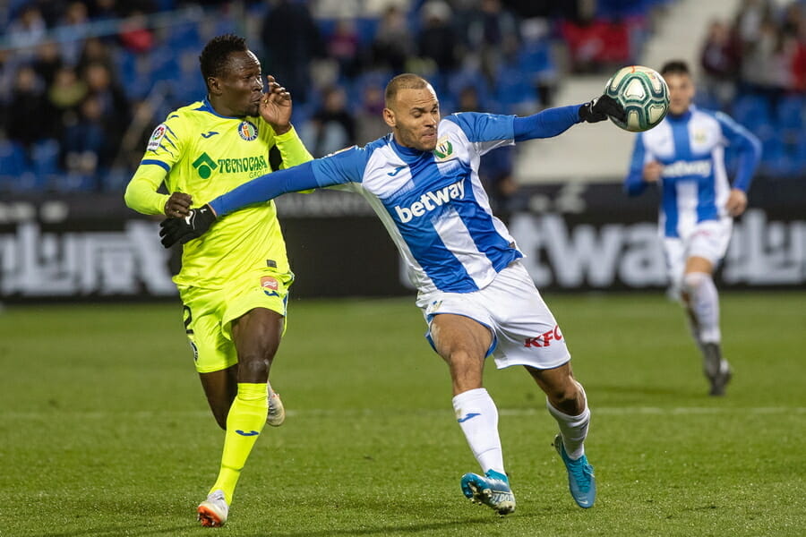epa08137149 Leganes' Danish forward Martin Braithwaite (R) fights with Djené Dakonam (L) of Getafe CF during the Spanish LaLiga soccer match between CD Leganes and Getafe CF at Butarque Stadium, in Leganes, Madrid, Spain, 17 January 2020.  EPA