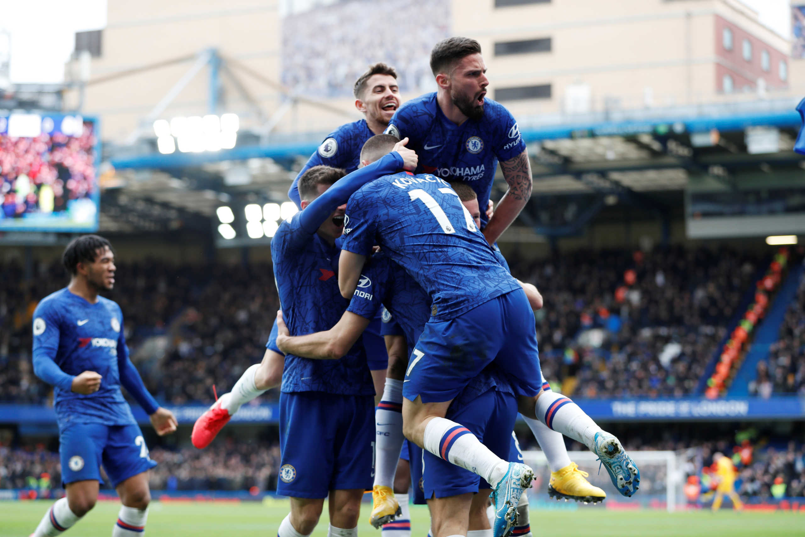 Soccer Football - Premier League - Chelsea v Tottenham Hotspur - Stamford Bridge, London, Britain - February 22, 2020  Chelsea's Marcos Alonso celebrates scoring their second goal with Olivier Giroud and teammates  Action Images via Reuters