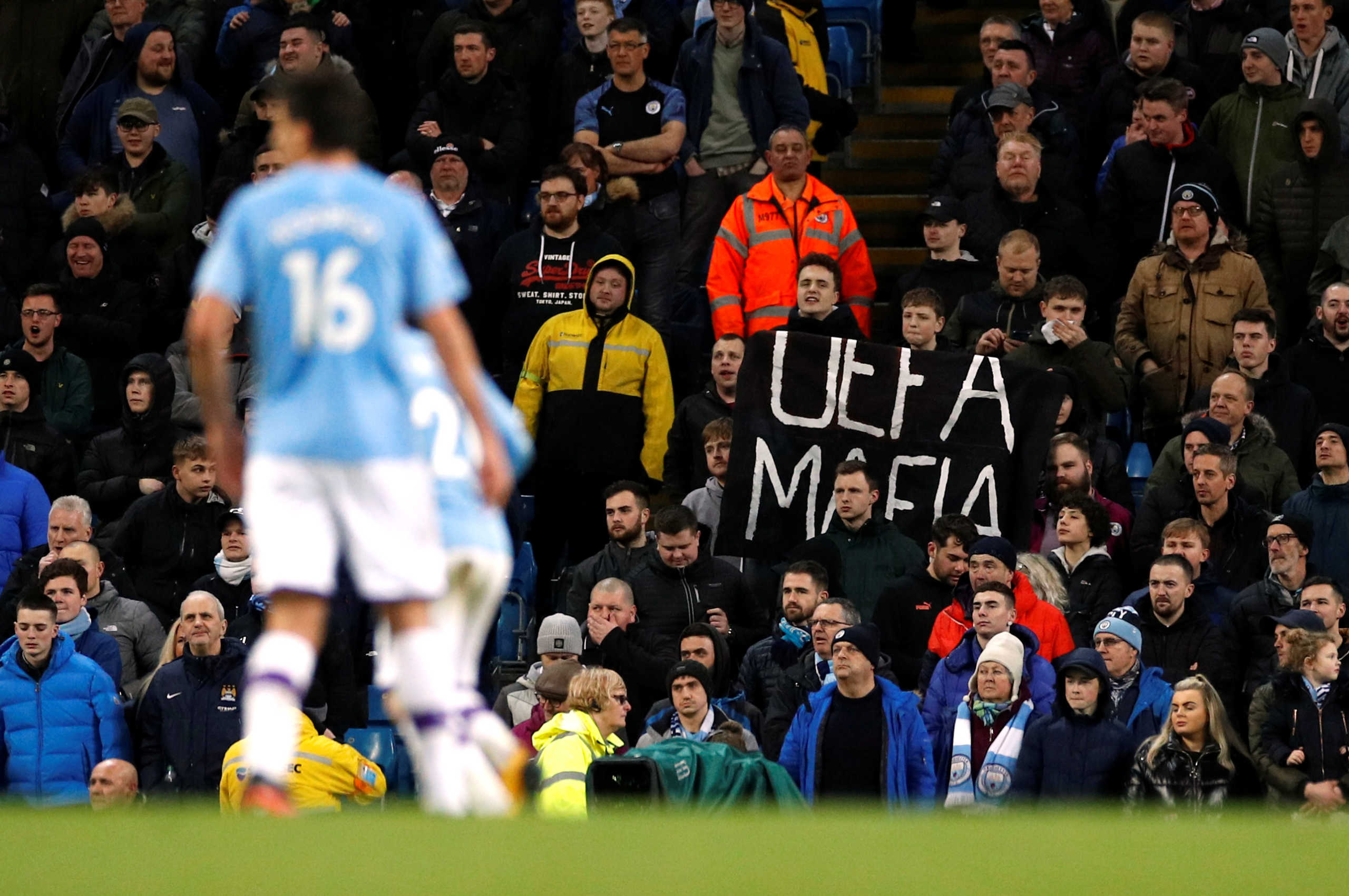 Soccer Football - Premier League - Manchester City v West Ham United - Etihad Stadium, Manchester, Britain - February 19, 2020  Manchester City fans display a sign in reference to UEFA during the match   REUTERS
