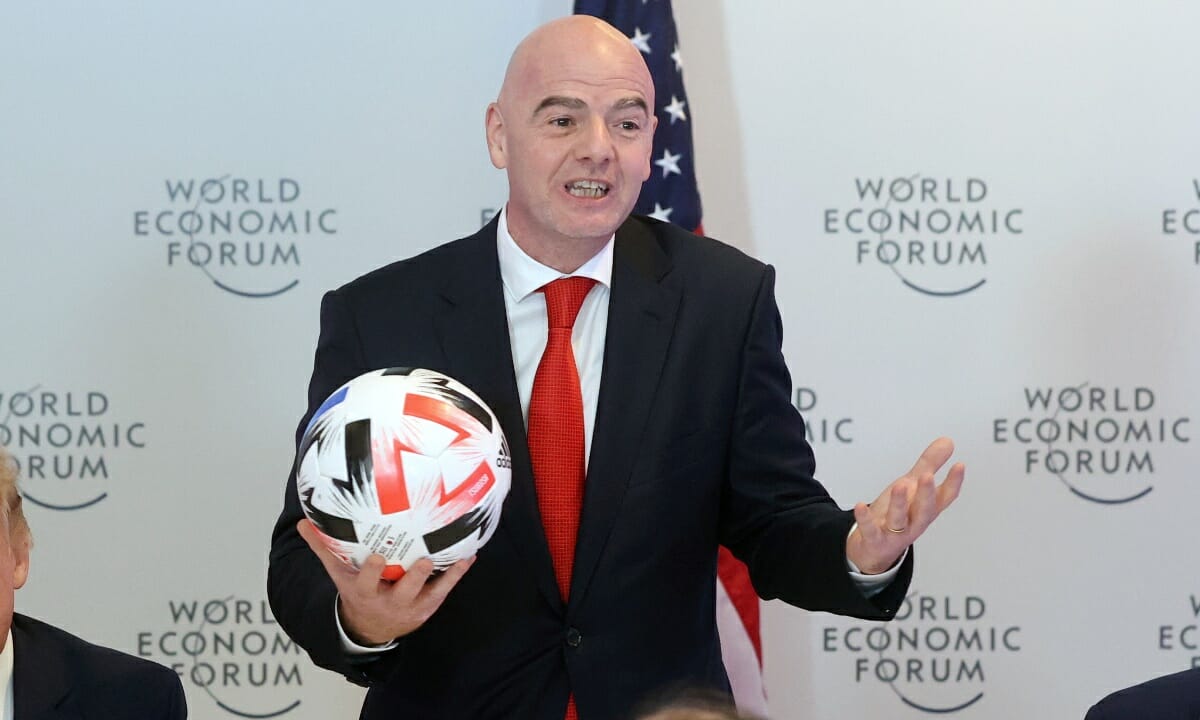 U.S. President Donald Trump listens to FIFA President Gianni Infantino speak during a dinner with global CEOs during the 50th World Economic Forum (WEF) annual meeting in Davos, Switzerland, January 21, 2020. REUTERS
