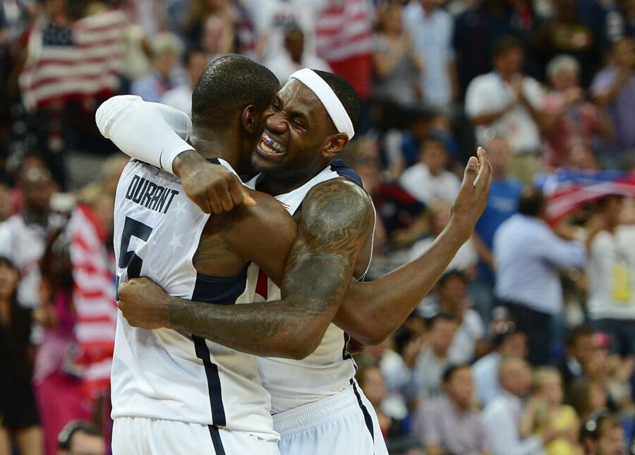 epa03360064 LeBron James (R) and Kevin Durant of Team USA celebrate during the last minute against Team Spain in the Gold Medal Game at North Greenwich Arena in London, England 12 August 2012.  EPA