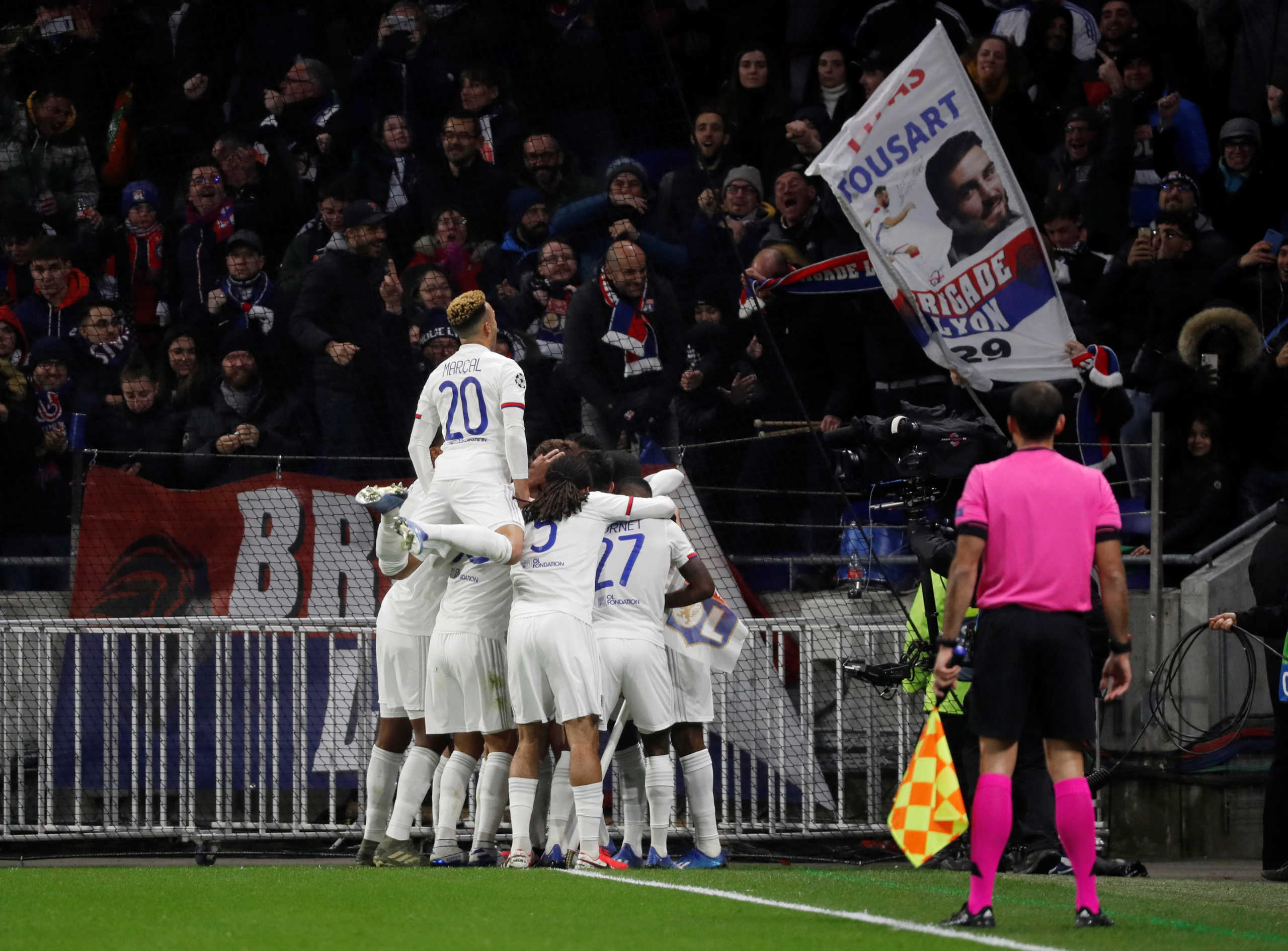 Soccer Football - Champions League - Round of 16 First Leg - Olympique Lyonnais v Juventus - Groupama Stadium, Lyon, France - February 26, 2020  Olympique Lyonnais' Lucas Tousart celebrates scoring their first goal with teammates    REUTERS
