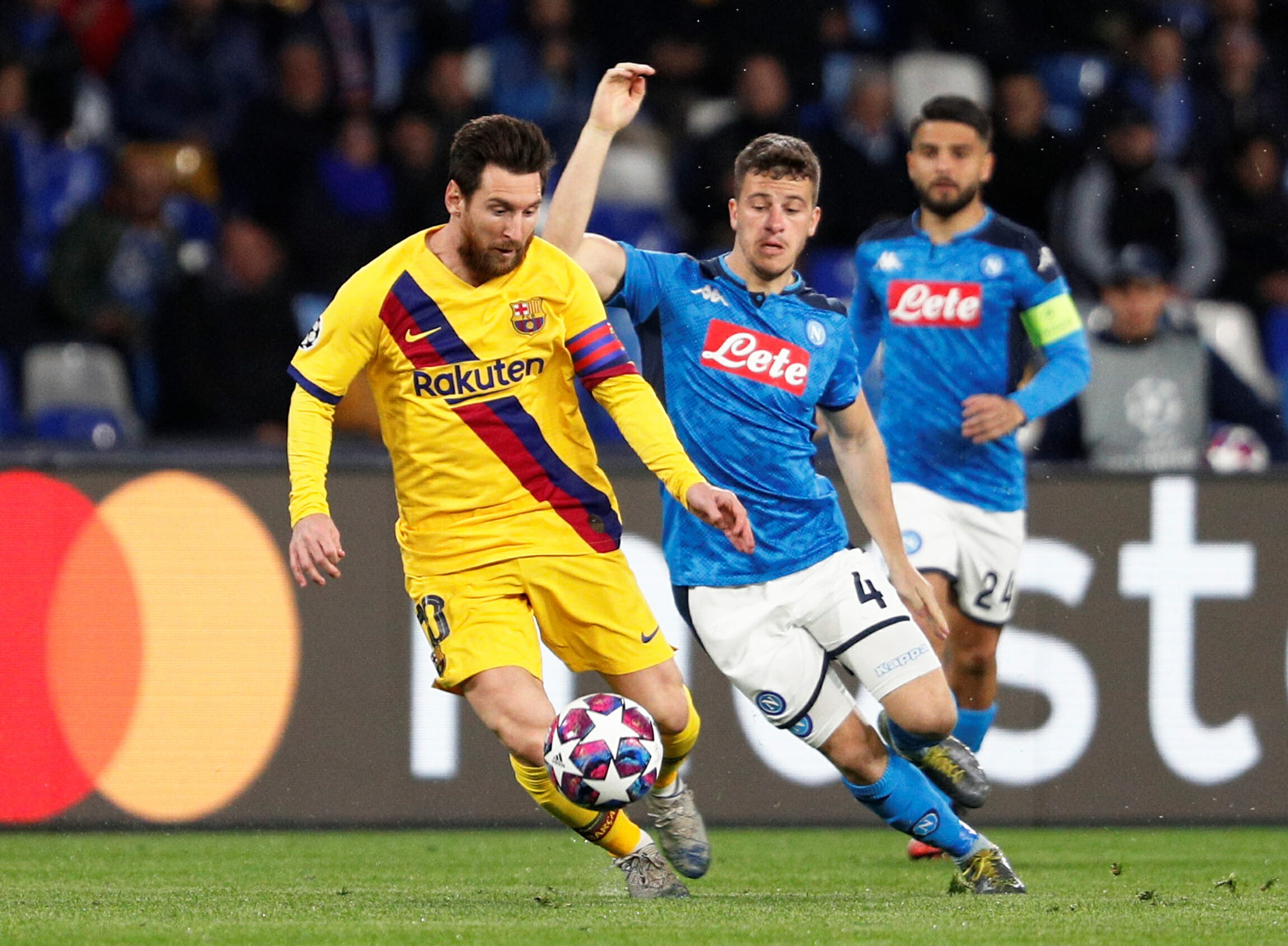 Soccer Football - Champions League - Round of 16 First Leg - Napoli v FC Barcelona - Stadio San Paolo, Naples, Italy - February 25, 2020  Barcelona's Lionel Messi in action with Napoli's Diego Demme    REUTERS