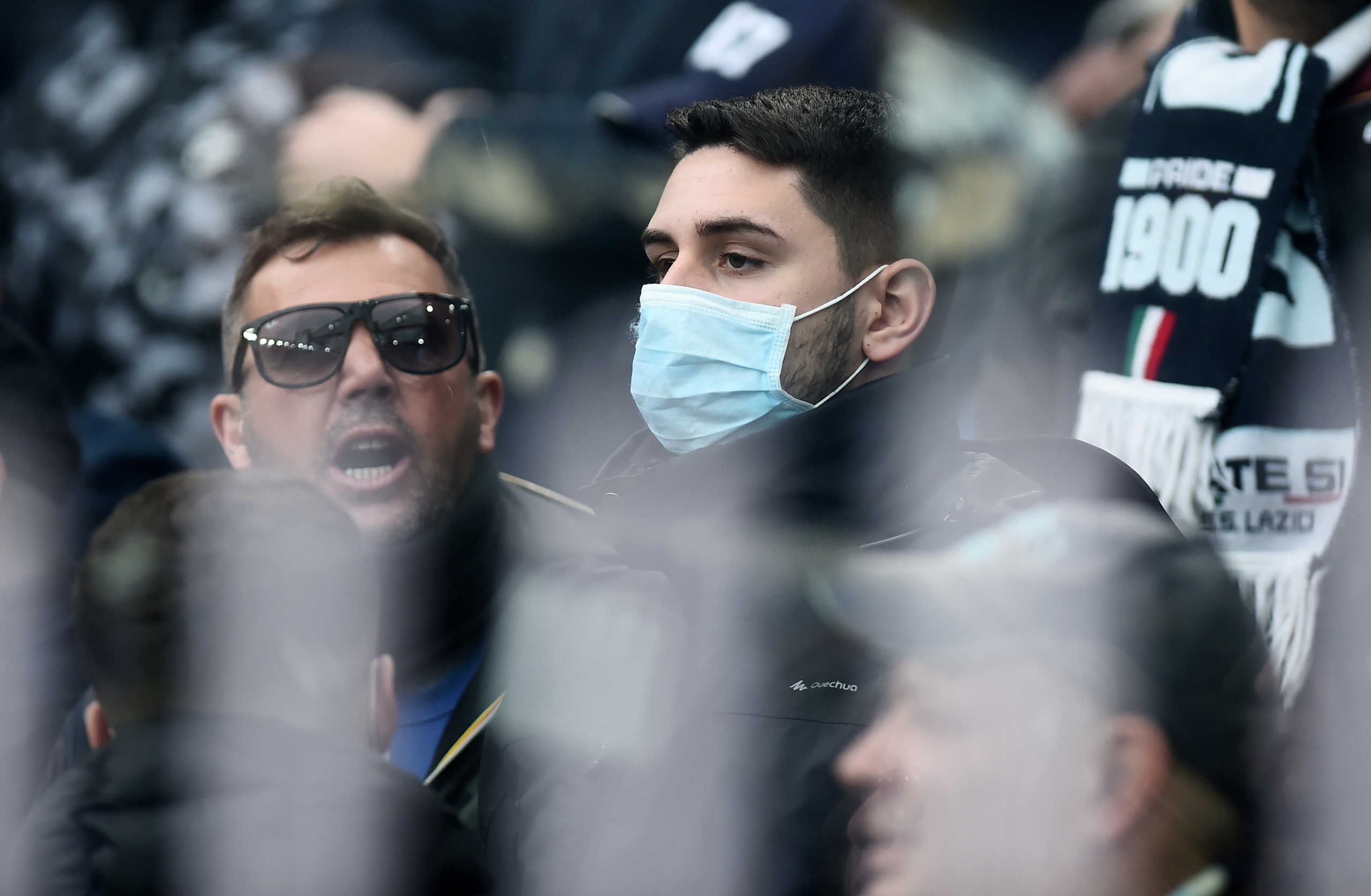 Soccer Football - Serie A - Genoa v Lazio - Stadio Comunale Luigi Ferraris, Genoa, Italy - February 23, 2020  General view of a Lazio fan wearing a face mask amid concern following a coronavirus outbreak in Italy before the match   REUTERS