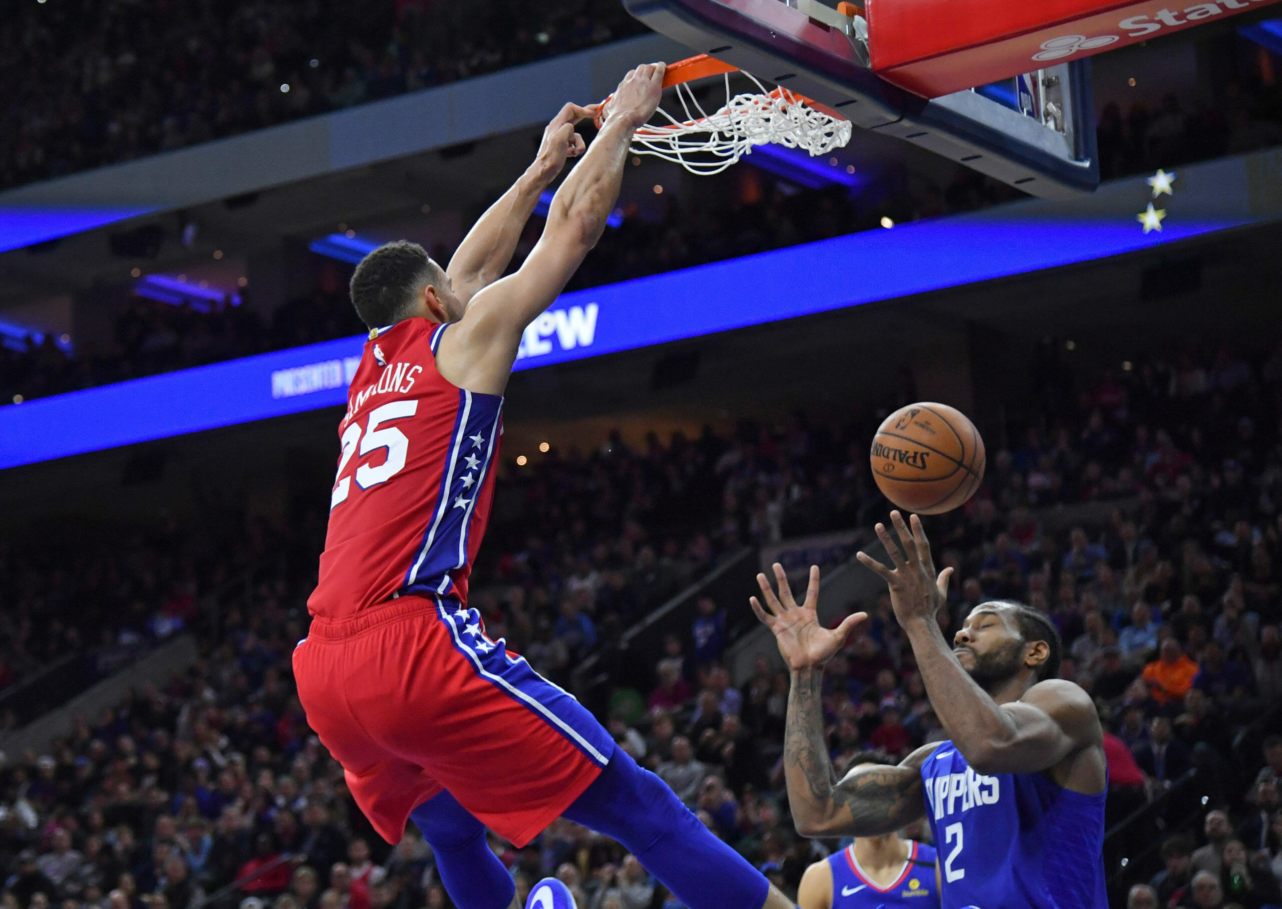 Feb 11, 2020; Philadelphia, Pennsylvania, USA; Philadelphia 76ers guard Ben Simmons (25) dunks against LA Clippers forward Kawhi Leonard (2) during the third quarter at Wells Fargo Center. Mandatory Credit: Eric Hartline-USA TODAY Sports
