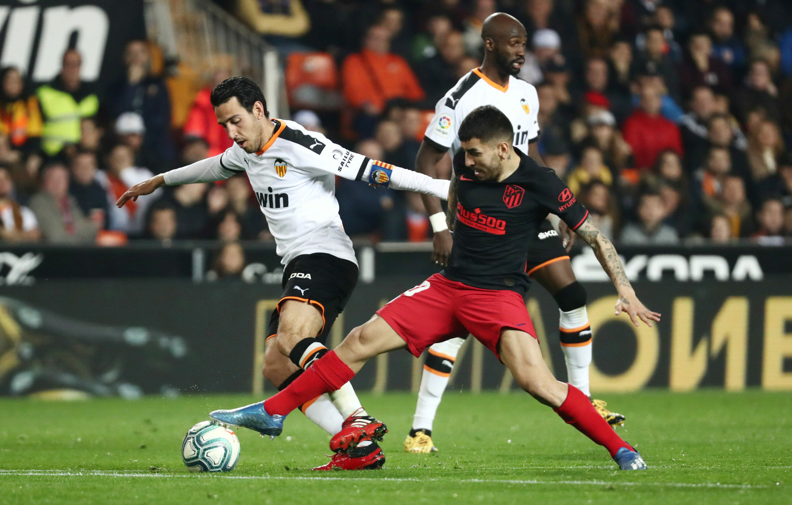 Soccer Football - La Liga Santander - Valencia v Atletico Madrid - Mestalla, Valencia, Spain - February 14, 2020  Atletico Madrid's Angel Correa in action with Valencia's Dani Parejo     REUTERS