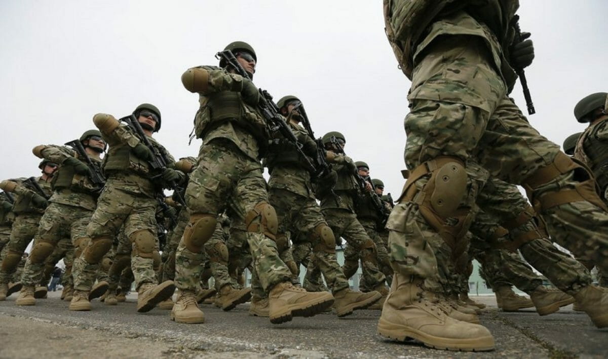 epa05228434 Georgian soldiers march at the military base of Vaziani outside Tbilisi during a farewell ceremony marking their departure to Afghanistan, in Tbilisi, Georgia, 24 March 2016. Georgian soldiers will take part in the NATO peace support mission in Afghanistan.  EPA