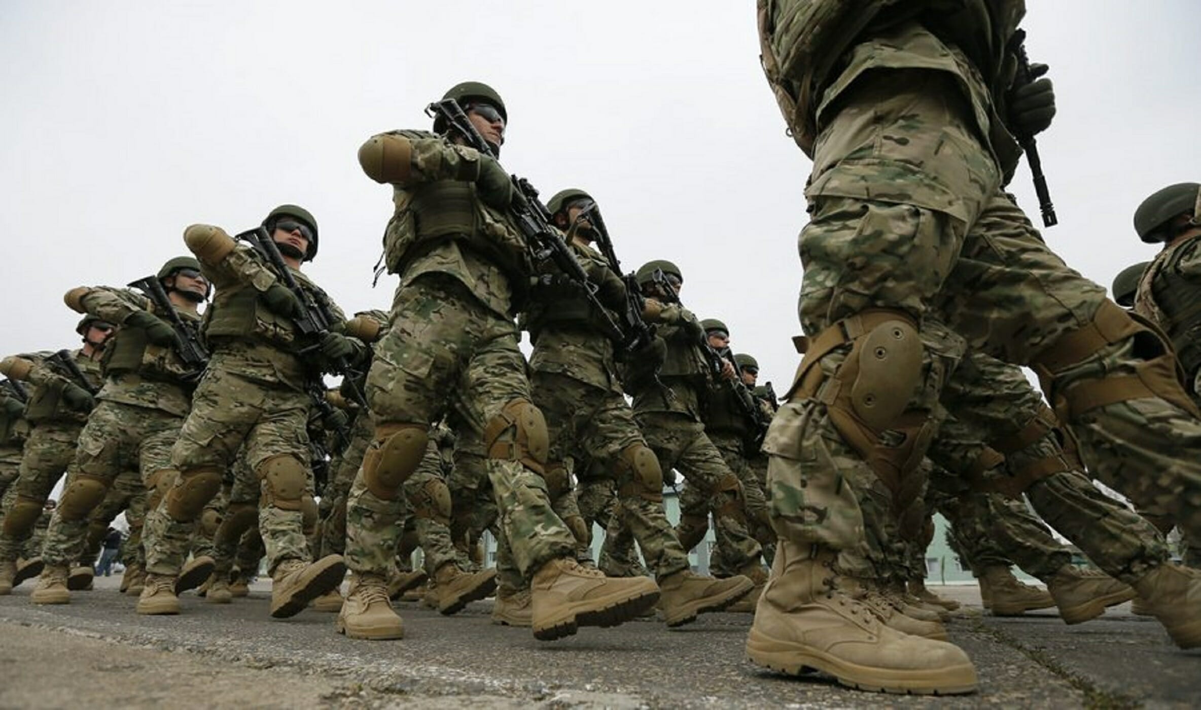 epa05228434 Georgian soldiers march at the military base of Vaziani outside Tbilisi during a farewell ceremony marking their departure to Afghanistan, in Tbilisi, Georgia, 24 March 2016. Georgian soldiers will take part in the NATO peace support mission in Afghanistan.  EPA
