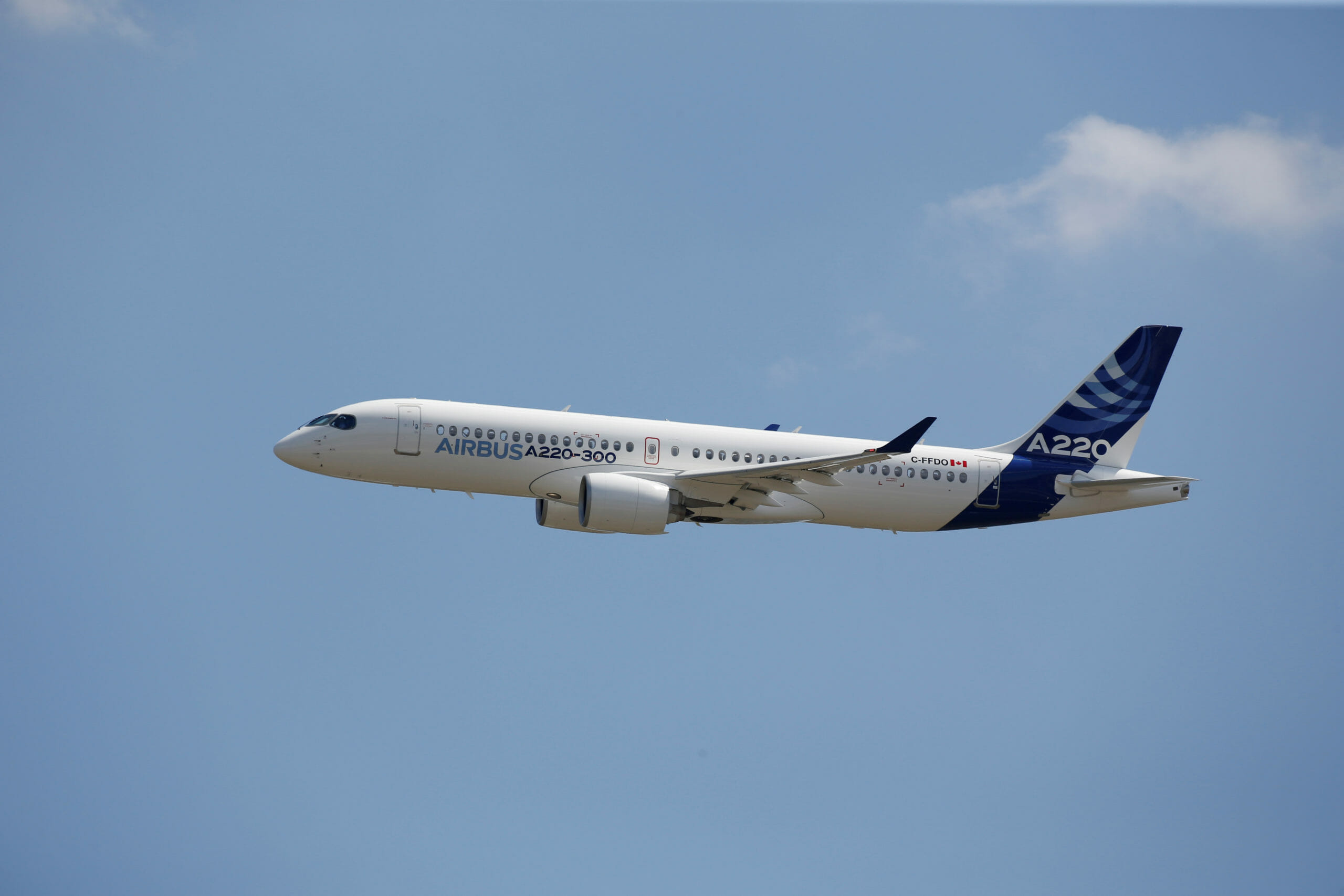 FILE PHOTO: An Airbus A220-300 aircraft flies during its unveiling in Colomiers near Toulouse, France, July 10, 2018. Airbus A220 is the new brand for the small CSeries passenger jet acquired from Canada's Bombardier. REUTERS