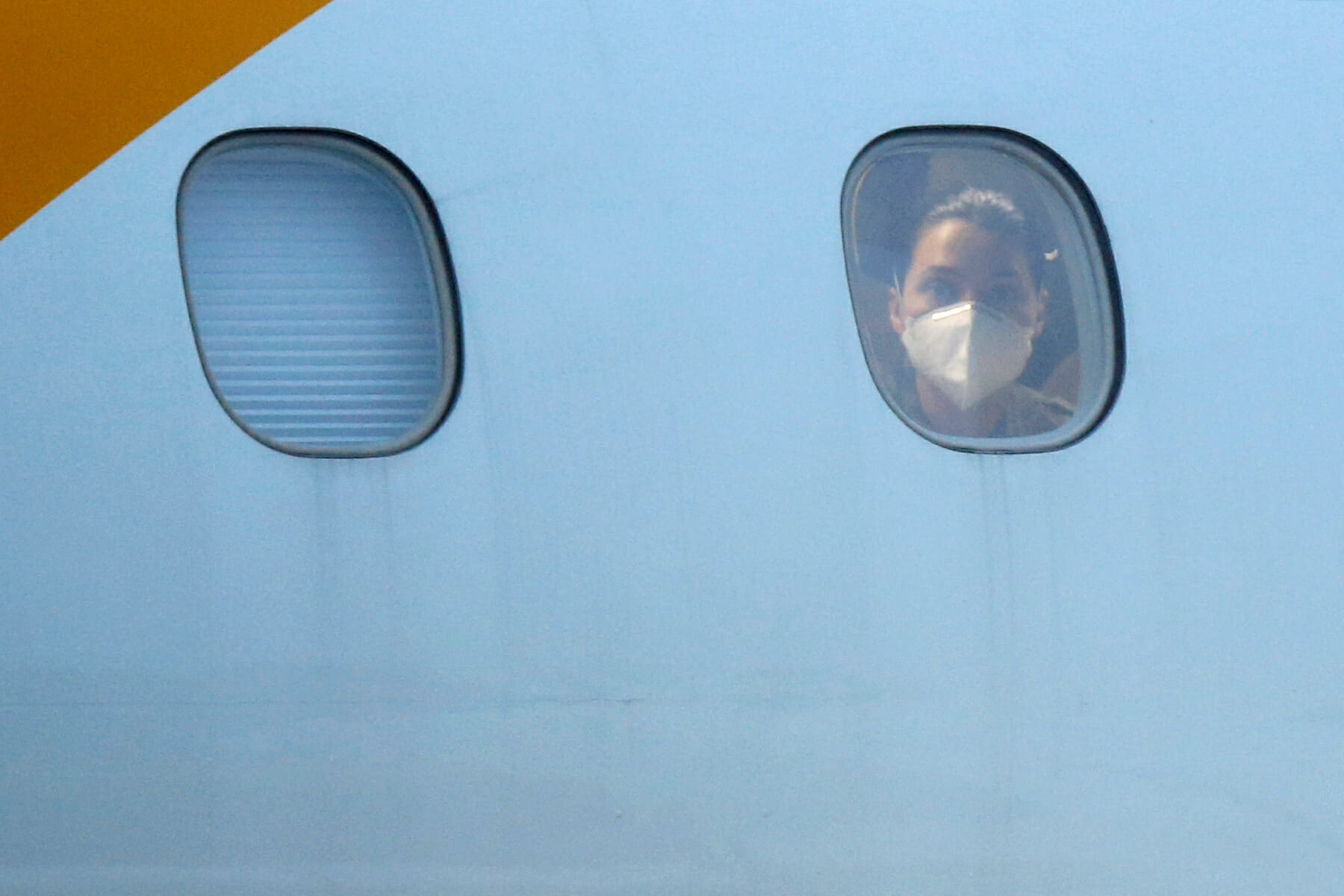 A passenger from China's coronavirus-struck Wuhan arrives at the Air Force base of Anapolis, State of Goias, Brazil, February 9, 2020. REUTERS