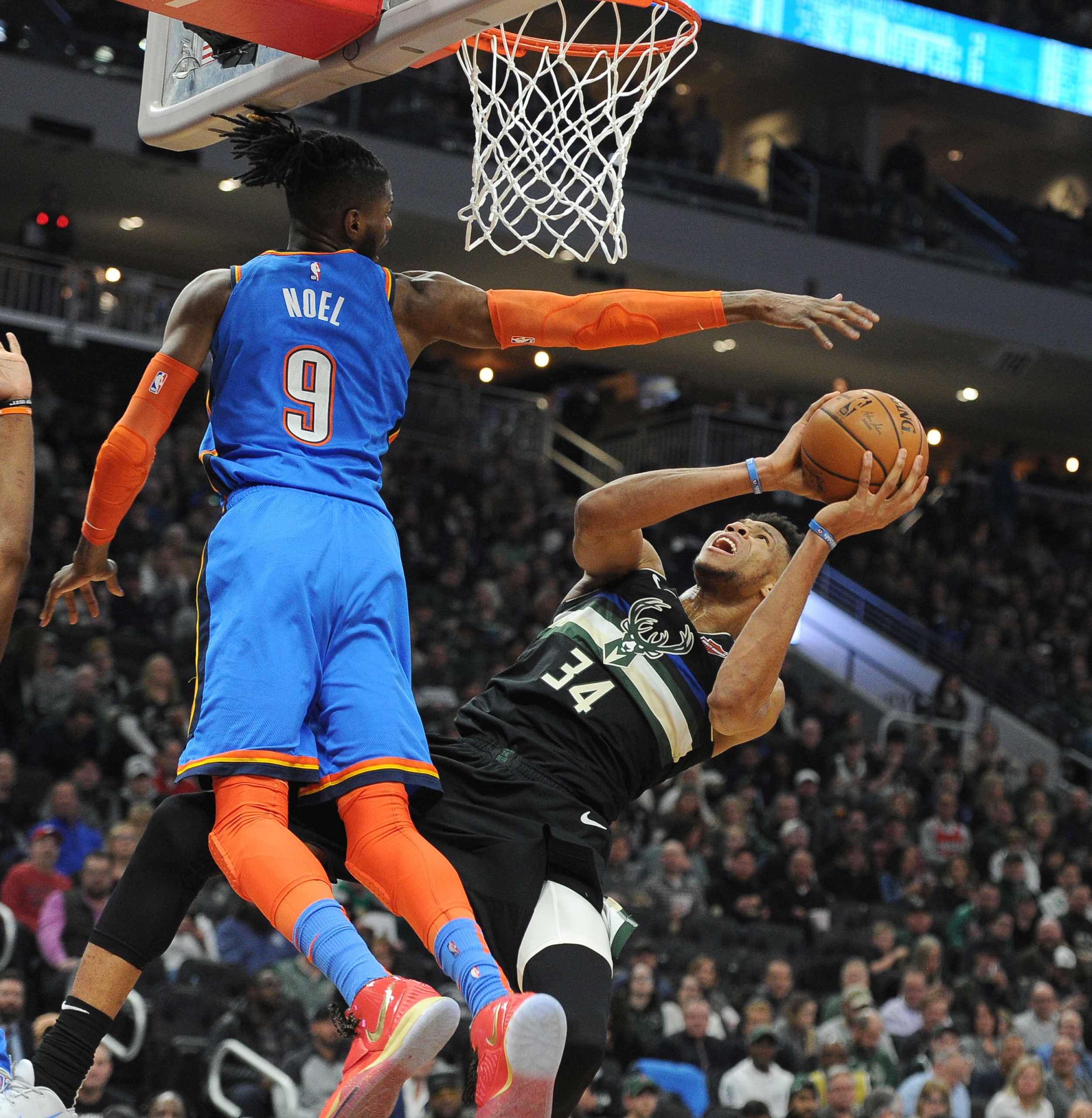 Feb 28, 2020; Milwaukee, Wisconsin, USA;  Milwaukee Bucks forward Giannis Antetokounmpo (34) puts up an unbalanced shot against Oklahoma City Thunder center Nerlens Noel (9) in the second half at Fiserv Forum. Mandatory Credit: Michael McLoone-USA TODAY Sports