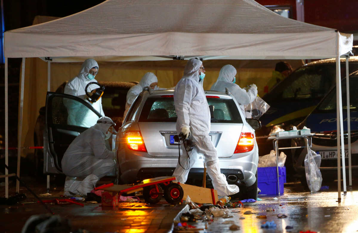 Police forensic officers work at the scene after a car ploughed into a carnival parade injuring several people in Volkmarsen, Germany February 24, 2020. REUTERS