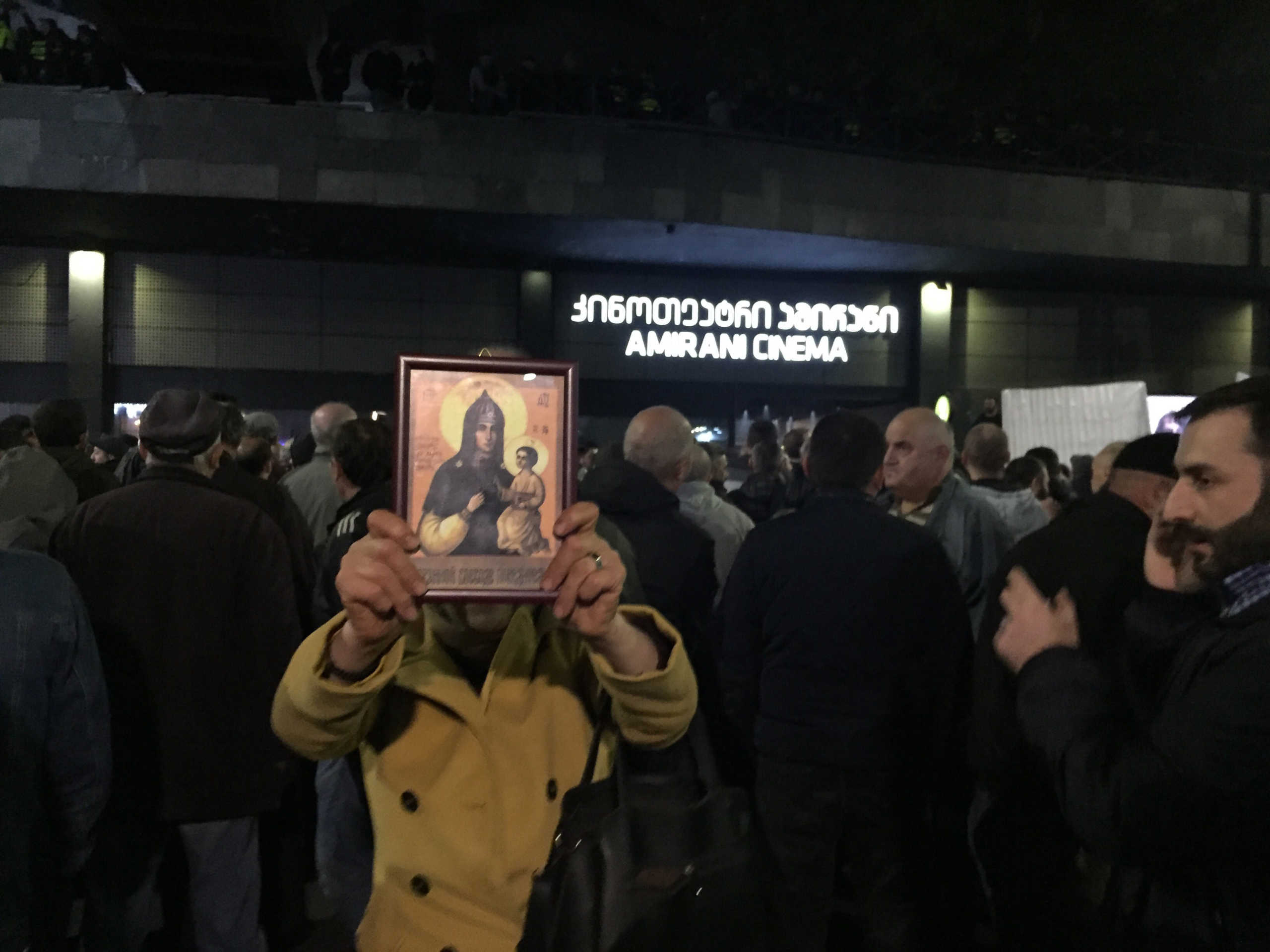 A woman holds a religious icon as she protests against the screening of "And Then We Danced", a Georgian movie about gay love in Tbilisi, Georgia, November 8, 2019. Thomson Reuters Foundation