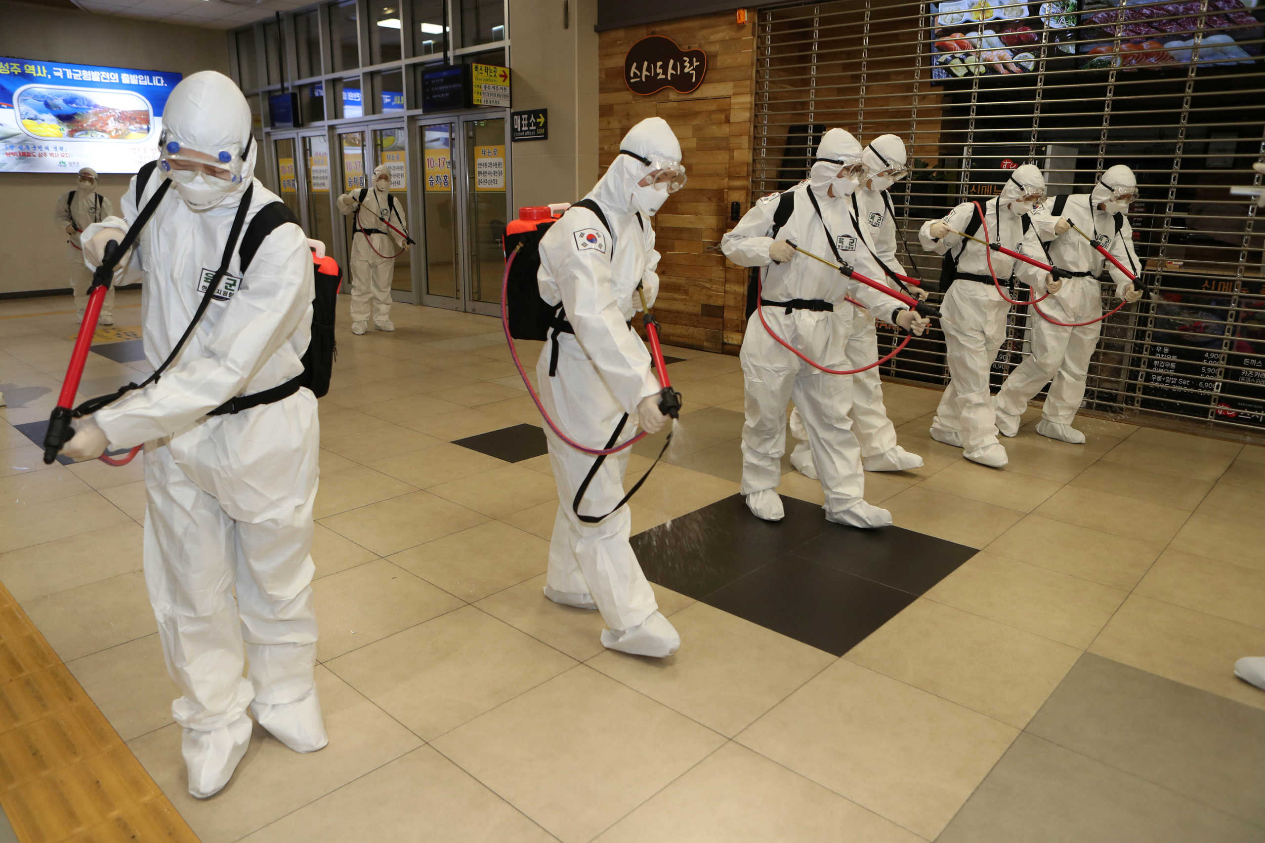 South Korean soldiers wearing protective gear sanitize Daegu railway station in Daegu, South Korea, February 29, 2020.    Yonhap via REUTERS   ATTENTION EDITORS - THIS IMAGE HAS BEEN SUPPLIED BY A THIRD PARTY. SOUTH KOREA OUT. NO RESALES. NO ARCHIVE.
