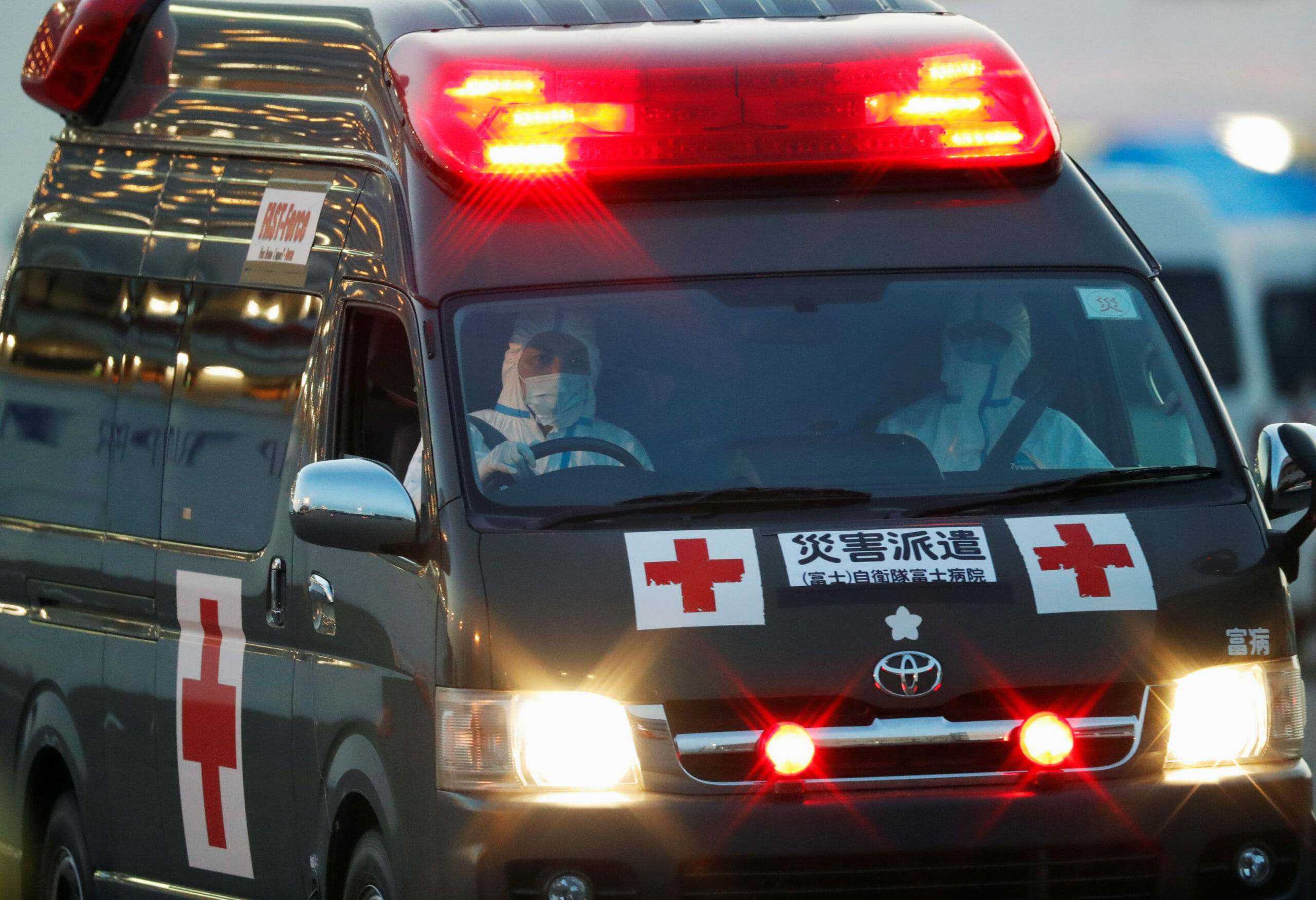 An ambulance from Japanese Self-Defence Force leaves the pier where the cruise ship Diamond Princess is anchored, as dozens of passengers were tested positive for coronavirus on board, at Daikoku Pier Cruise Terminal in Yokohama, south of Tokyo, Japan, February 11, 2020. REUTERS