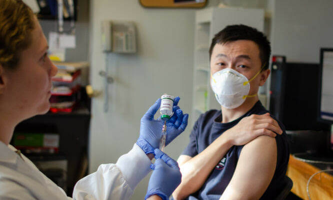 Illustrative picture of Chinese male getting vaccinated against coronavirus