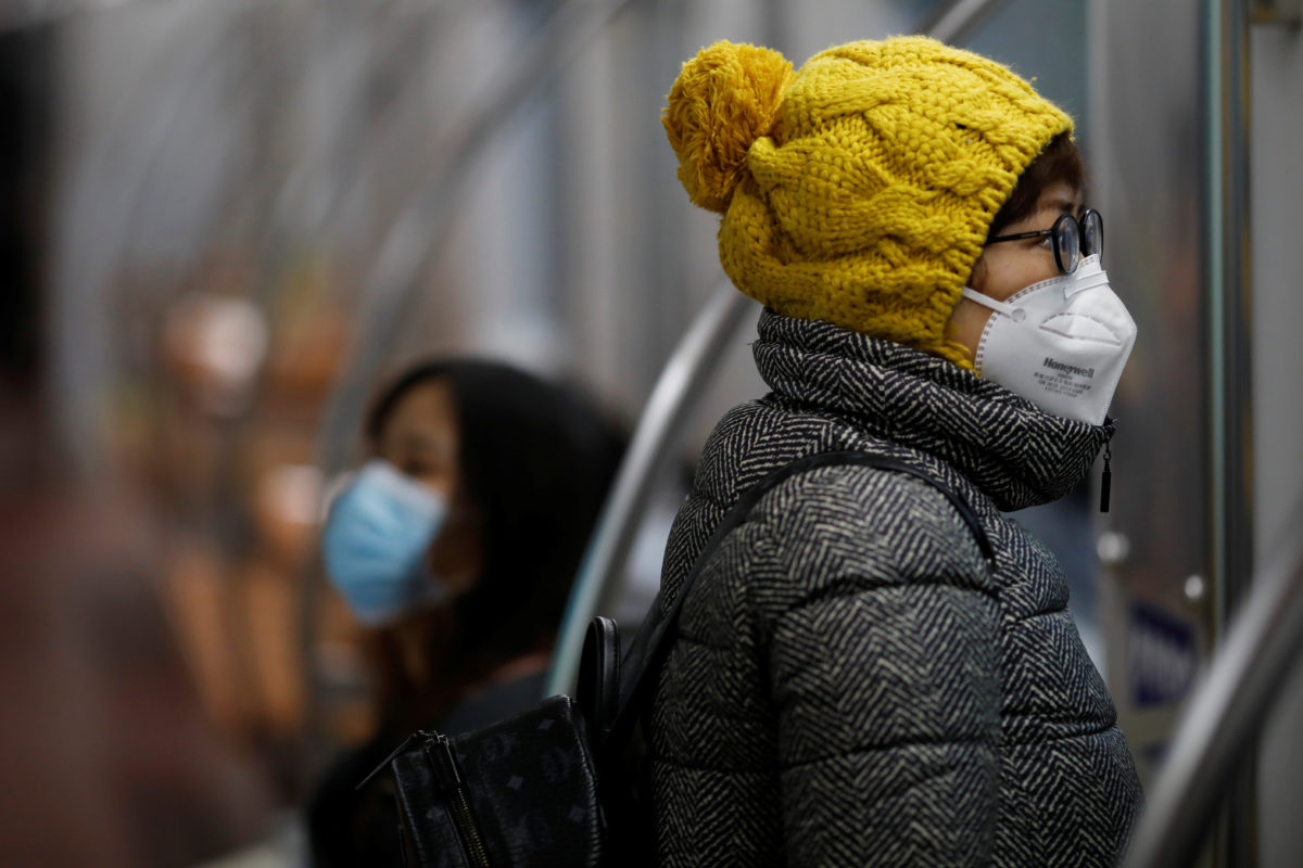 Women wearing face masks ride a subway in the morning after the extended Lunar New Year holiday caused by the novel coronavirus outbreak, in Beijing, China February 10, 2020.  REUTERS