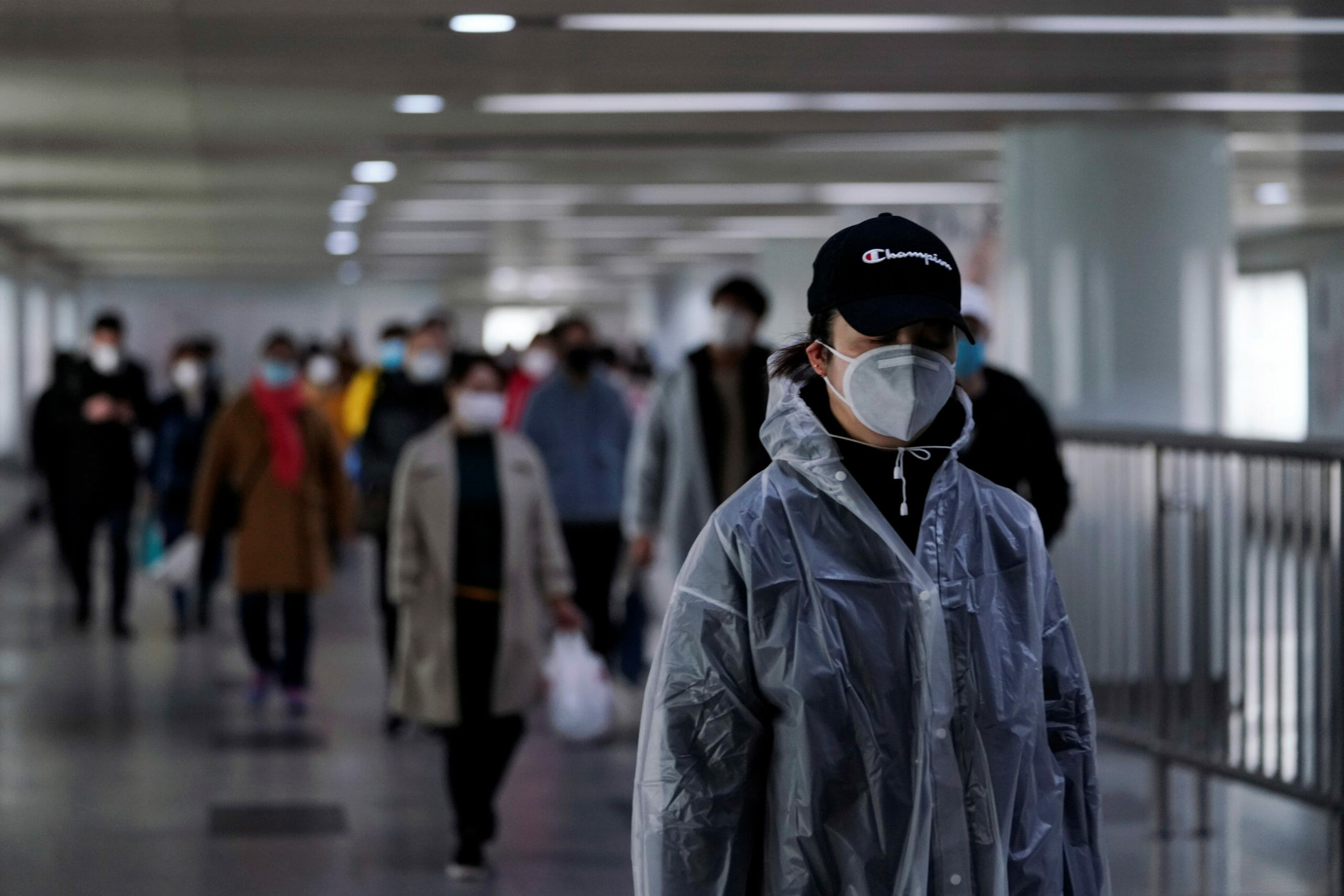 People wearing face masks are seen in an underpass leading to a subway station in the morning after the extended Lunar New Year holiday caused by the novel coronavirus outbreak, in Shanghai, China February 10, 2020.  REUTERS