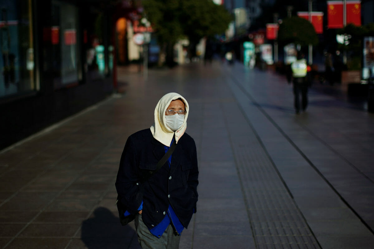 A man wearing a mask is seen at a main shopping area, in downtown Shanghai, China, as the country is hit by an outbreak of a new coronavirus, February 16, 2020. REUTERS