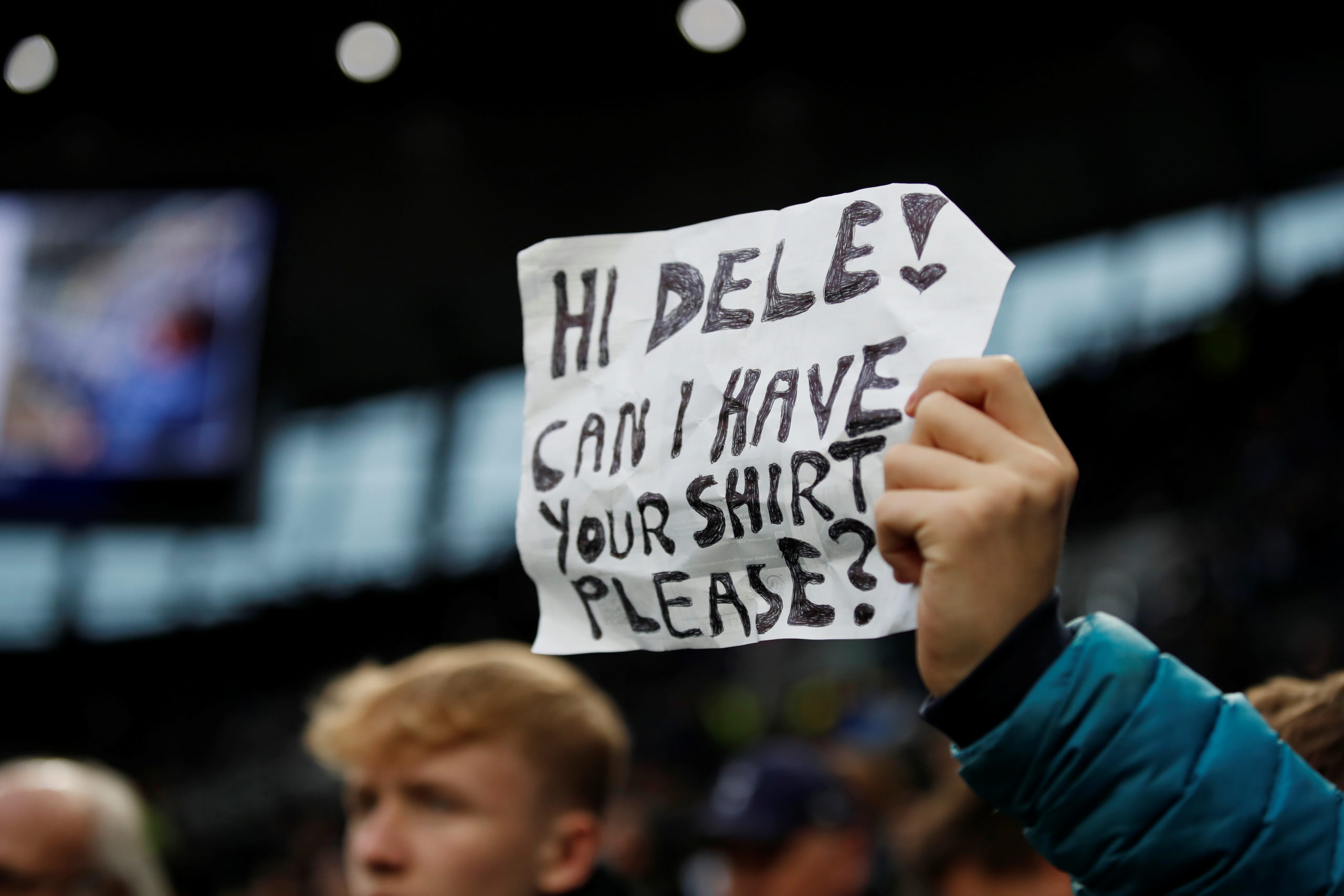 Soccer Football - Premier League - Tottenham Hotspur v Manchester City - Tottenham Hotspur Stadium, London, Britain - February 2, 2020  General view of a sign in reference to Tottenham Hotspur's Dele Alli held aloft by a fan before the match   REUTERS
