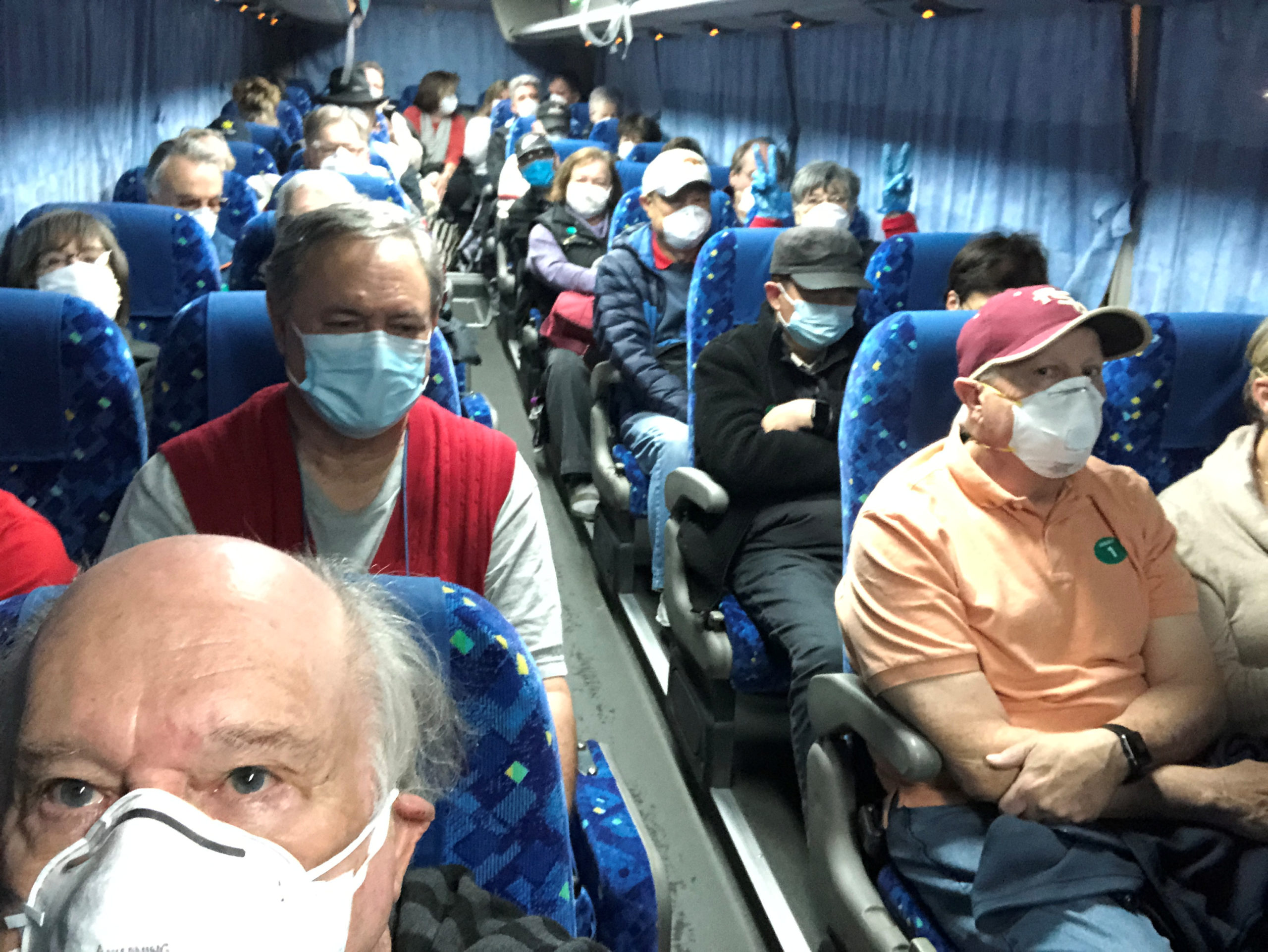 U.S. passengers on board the Diamond Princess cruise ship, who have chosen to leave, are transported by shuttle bus in Yokohama to Haneda airport to fly back to the United States via chartered evacuation aircraft, in Japan February 17, 2020. Courtesy of Philip and Gay Courter