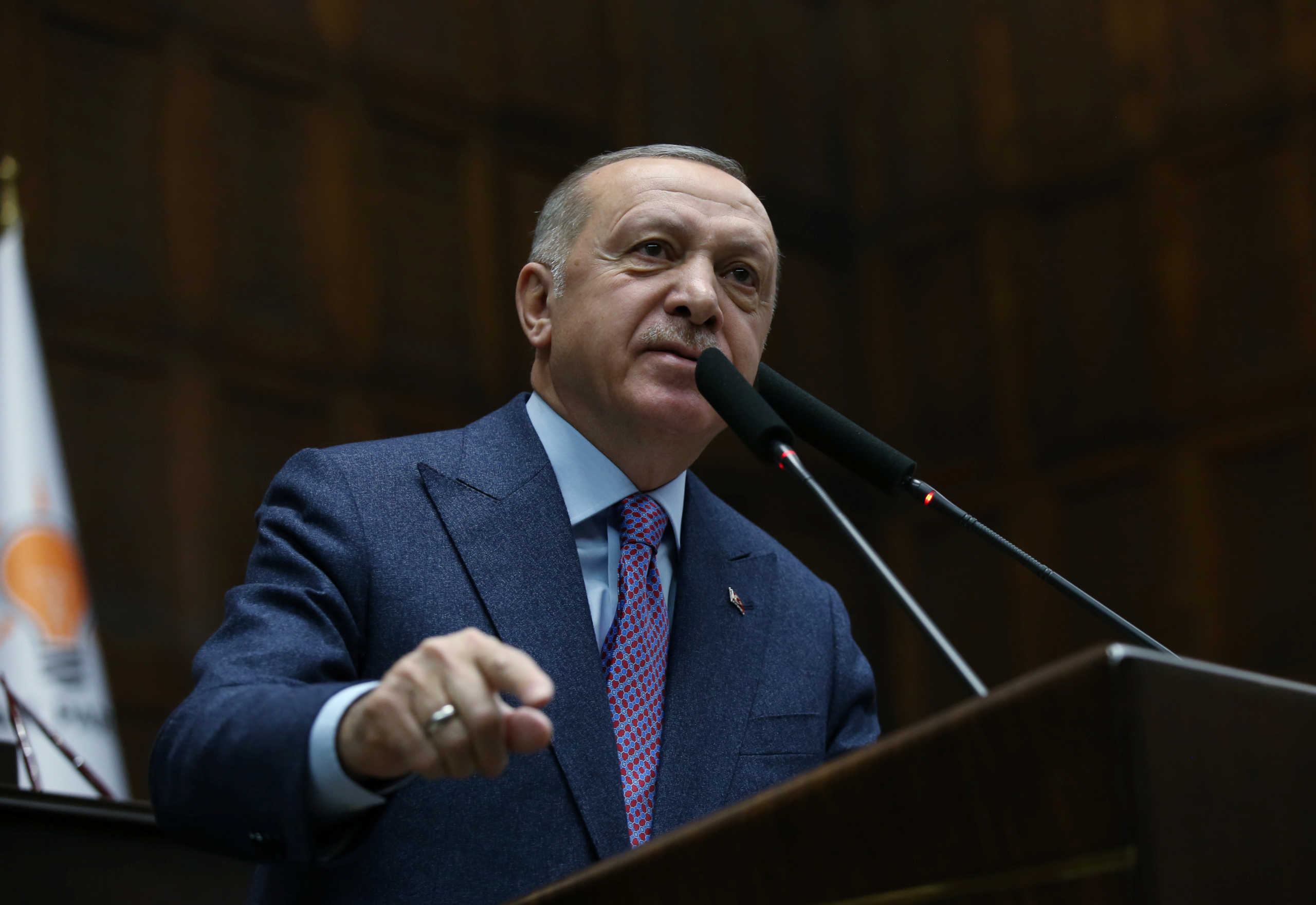 Turkish President Tayyip Erdogan addresses members of his ruling AK Party during a meeting at the Parliament in Ankara, Turkey, February 19, 2020. Turkish Presidential Press Office