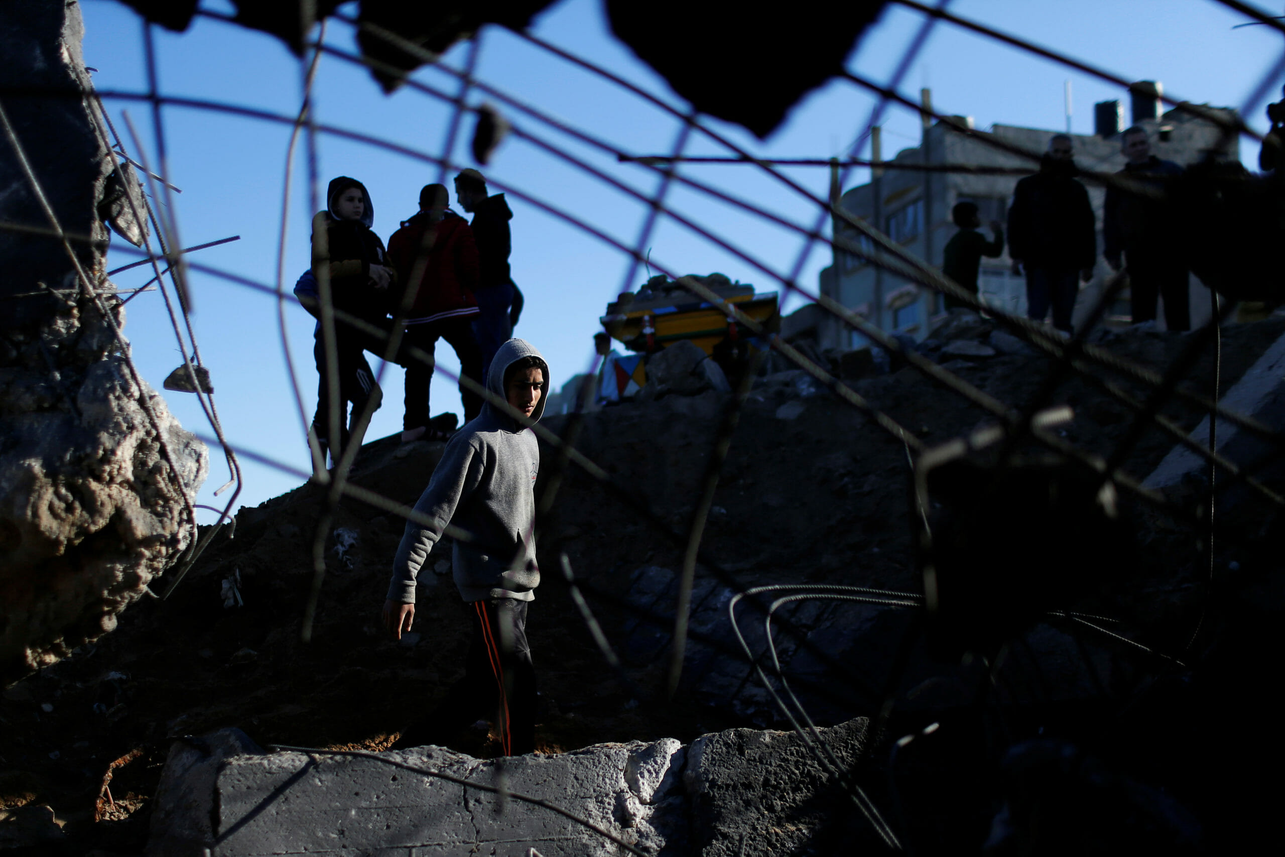Palestinians inspect the site of an Israeli air strike in Gaza City February 6, 2020. REUTERS