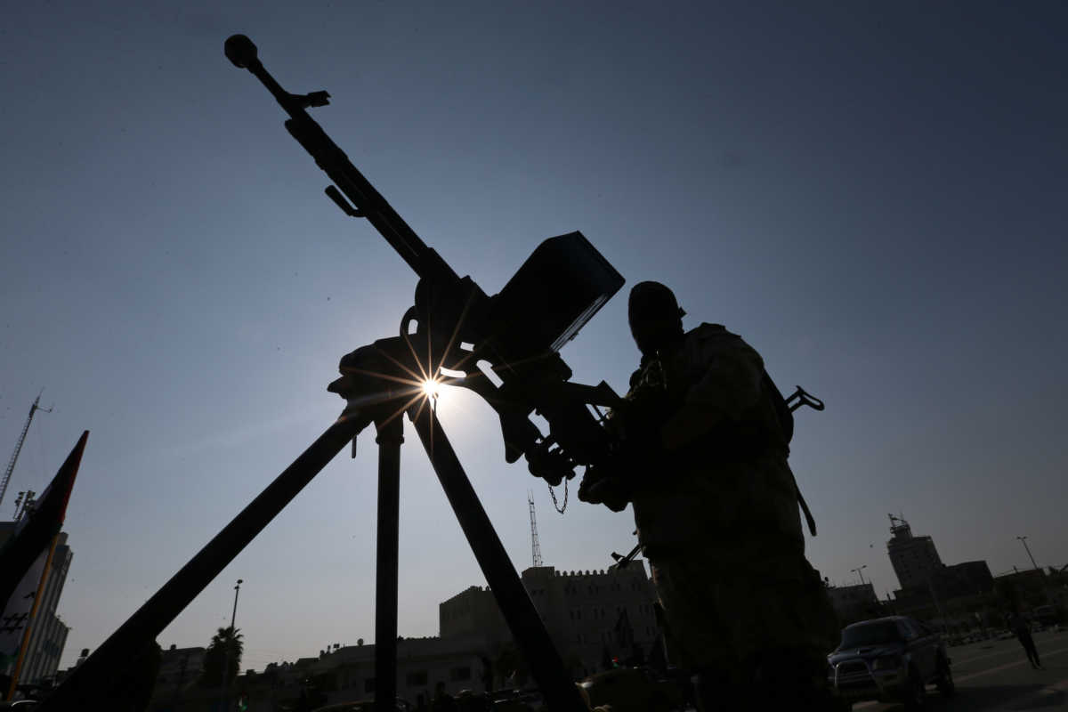 A Palestinian militant of the Al-Nasser Saladin Brigades rides on a pick-up truck mounted with a weapon during an anti-Israel military show in Khan Younis in the southern Gaza Strip February 17, 2020. REUTERS