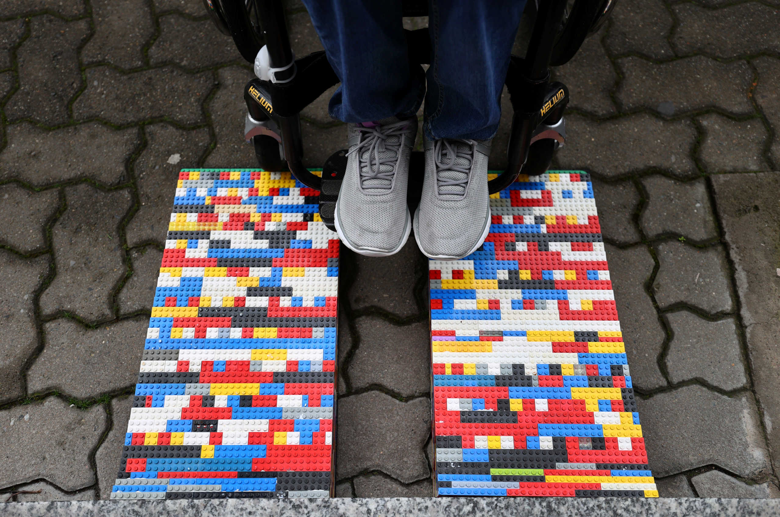 Rita Ebel, nicknamed "Lego grandma", tests one of her wheelchair ramps built from donated Lego bricks in Hanau, Germany, February 17, 2020. Picture taken February 17, 2020. Ebel started to build the ramps almost one year ago to raise awareness for handicapped people in her hometown of Hanau. Meanwhile, dozens of stores use the ramps to ease entry for wheelchair users.  REUTERS
