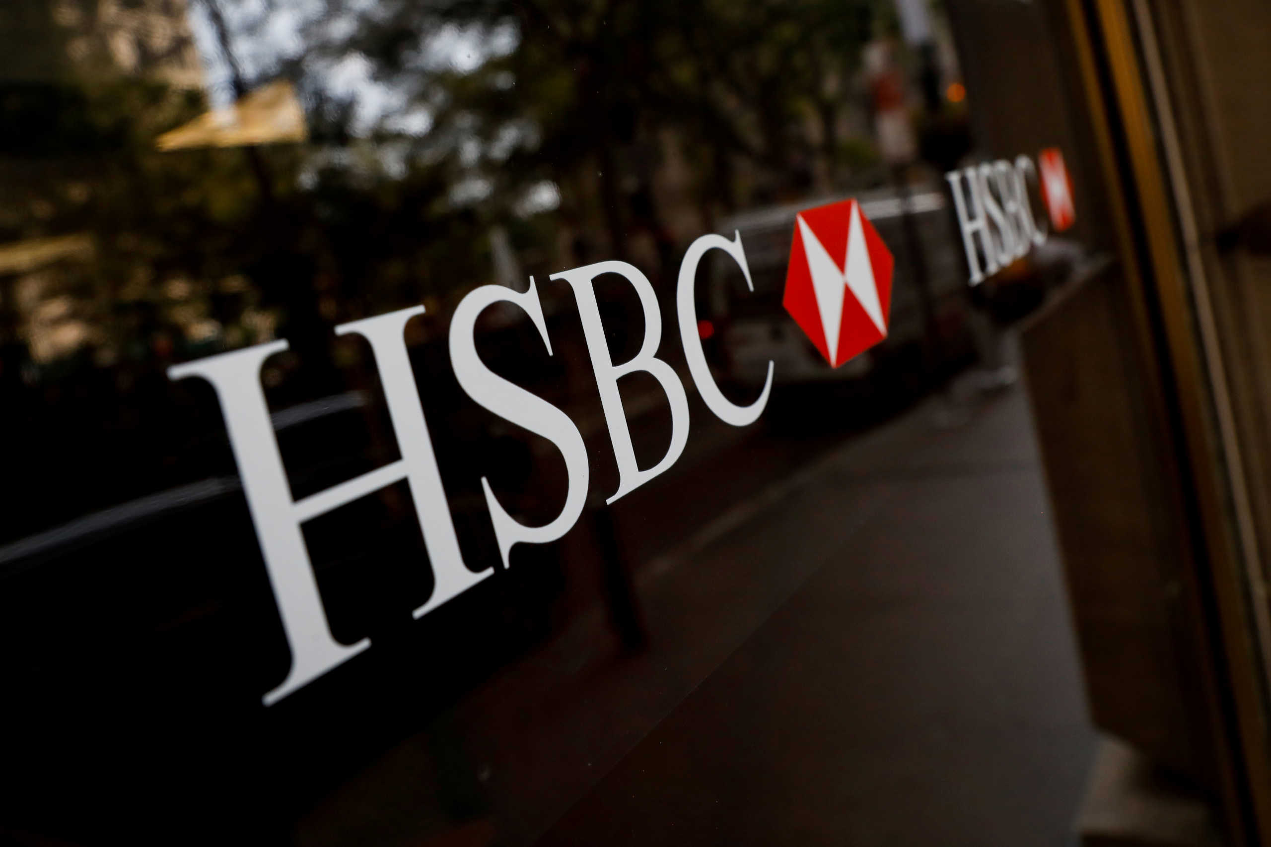 FILE PHOTO: HSBC logos are seen on a branch bank in the financial district in New York, U.S., August 7, 2019. REUTERS