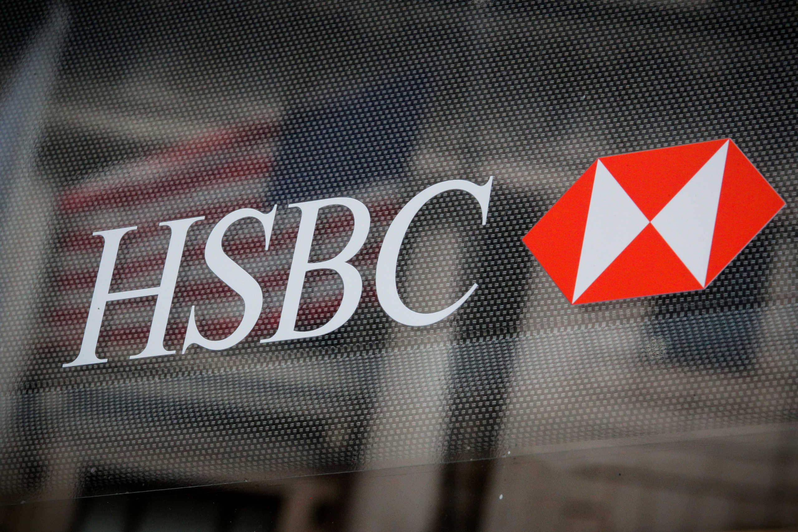 FILE PHOTO: HSBC logo is seen on a branch bank in the financial district in New York, U.S., August 7, 2019. REUTERS