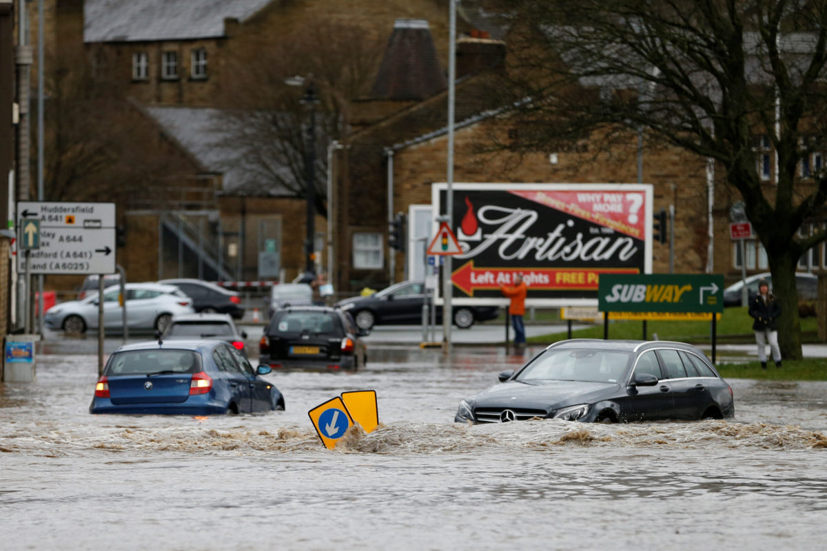 Cars sit in floodwater in Brighouse, West Yorkshire, Britain February 9, 2020. REUTERS