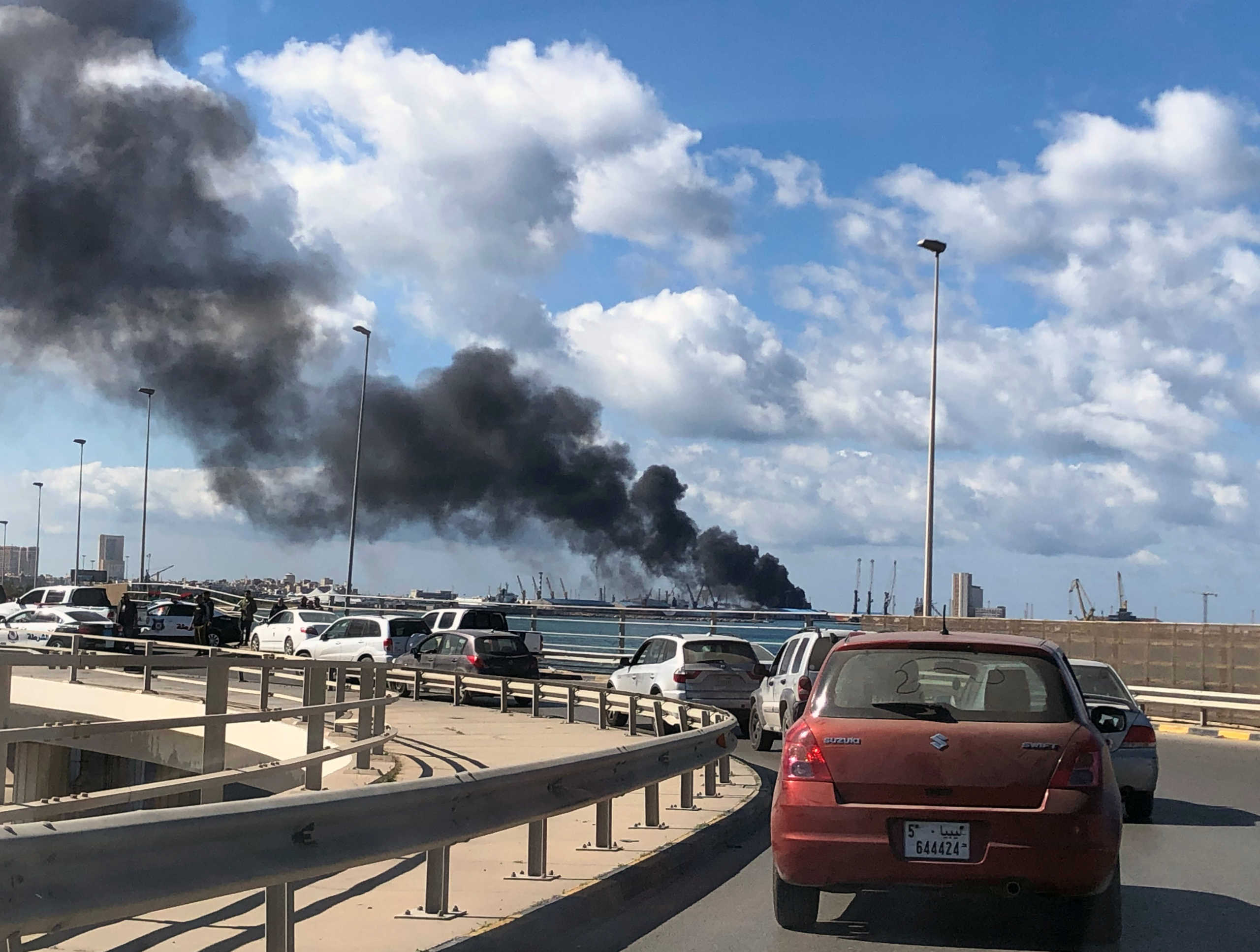 A smoke rises from a port of Tripoli after being attacked in Tripoli, Libya February 18, 2020. REUTERS