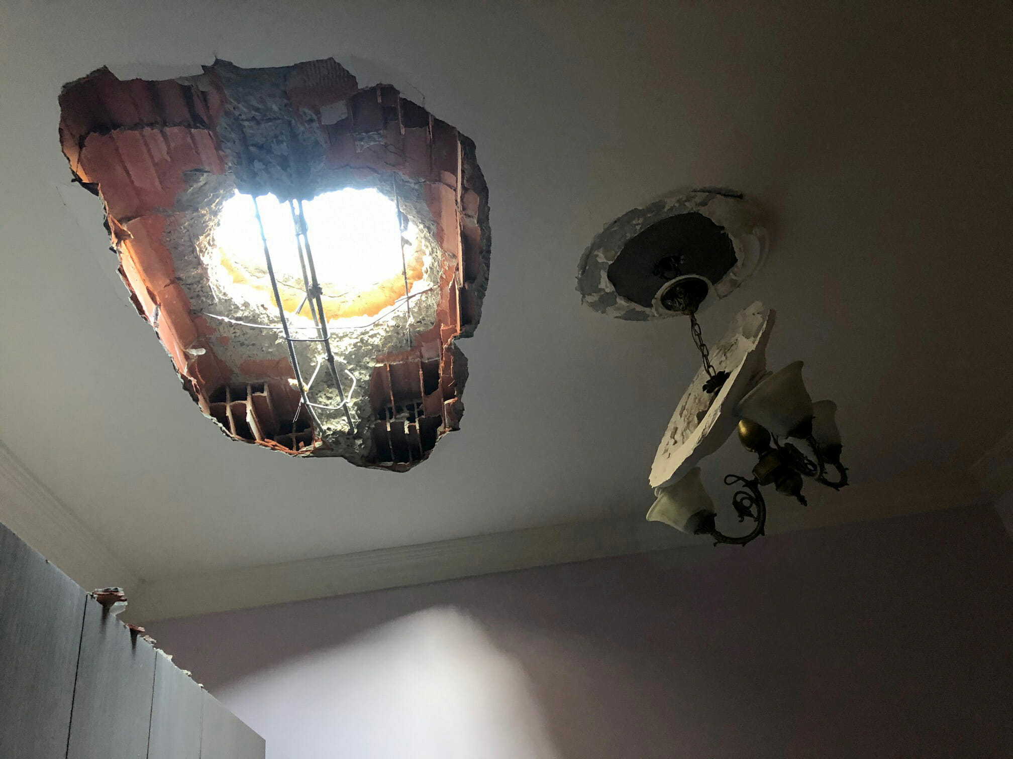 A hole is seen after a shell fell on a residential area in Hadba al-Badri district, in Tripoli, Libya January 28, 2020. REUTERS