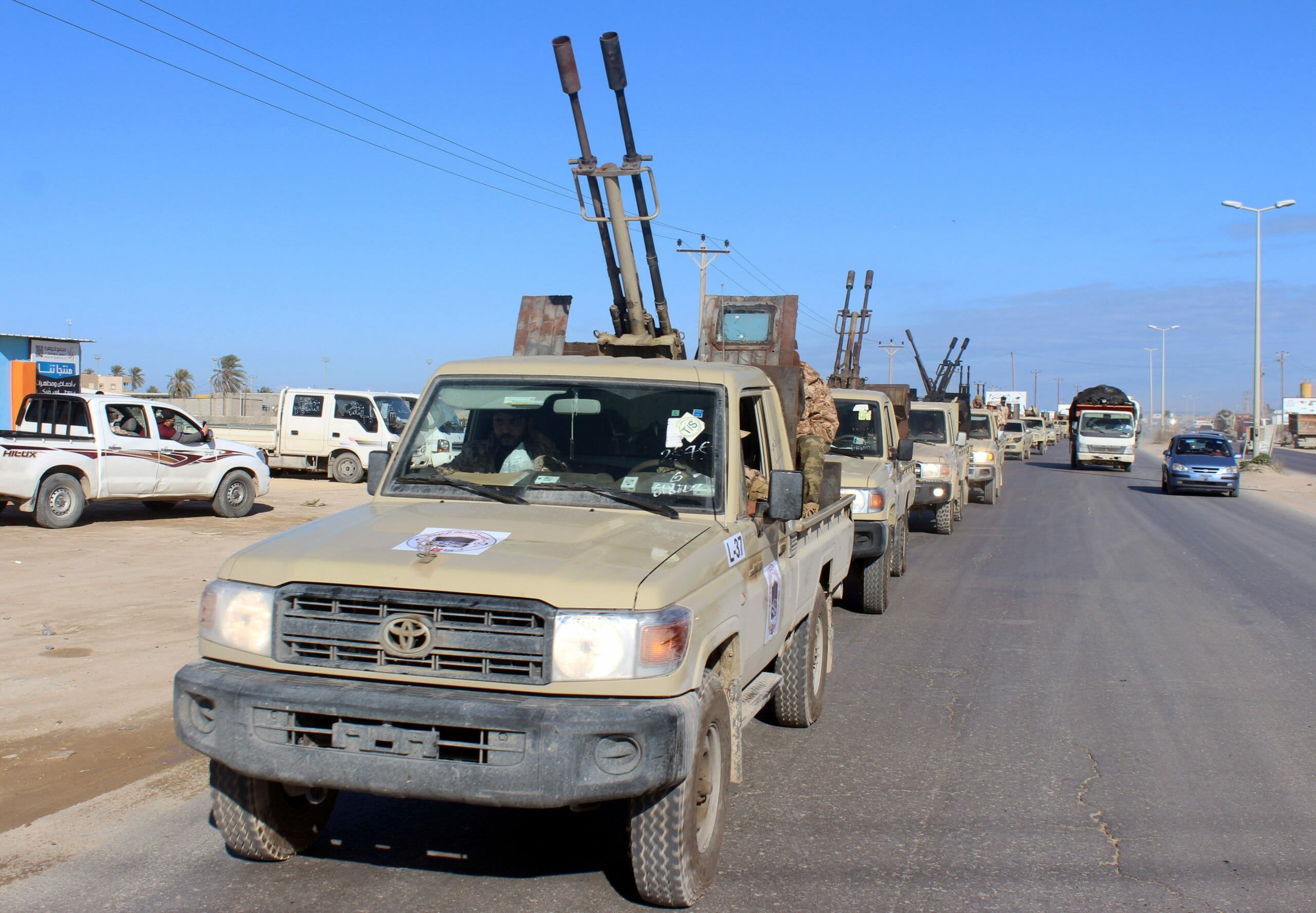 Military vehicles of the Libyan internationally recognised government forces head out to the front line from Misrata, Libya February 3, 2020. REUTERS