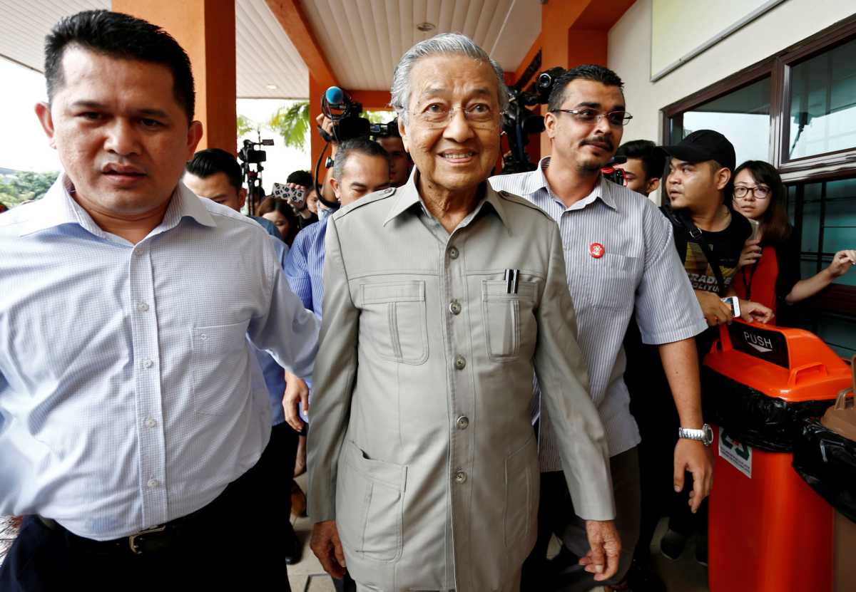 FILE PHOTO: Former Malaysian Prime Minister Mahathir Mohamad arrives to visit jailed opposition leader Anwar Ibrahim, who is recuperating from surgery, at Cheras Rehabilitation Hospital in Kuala Lumpur, Malaysia January 10, 2018. REUTERS