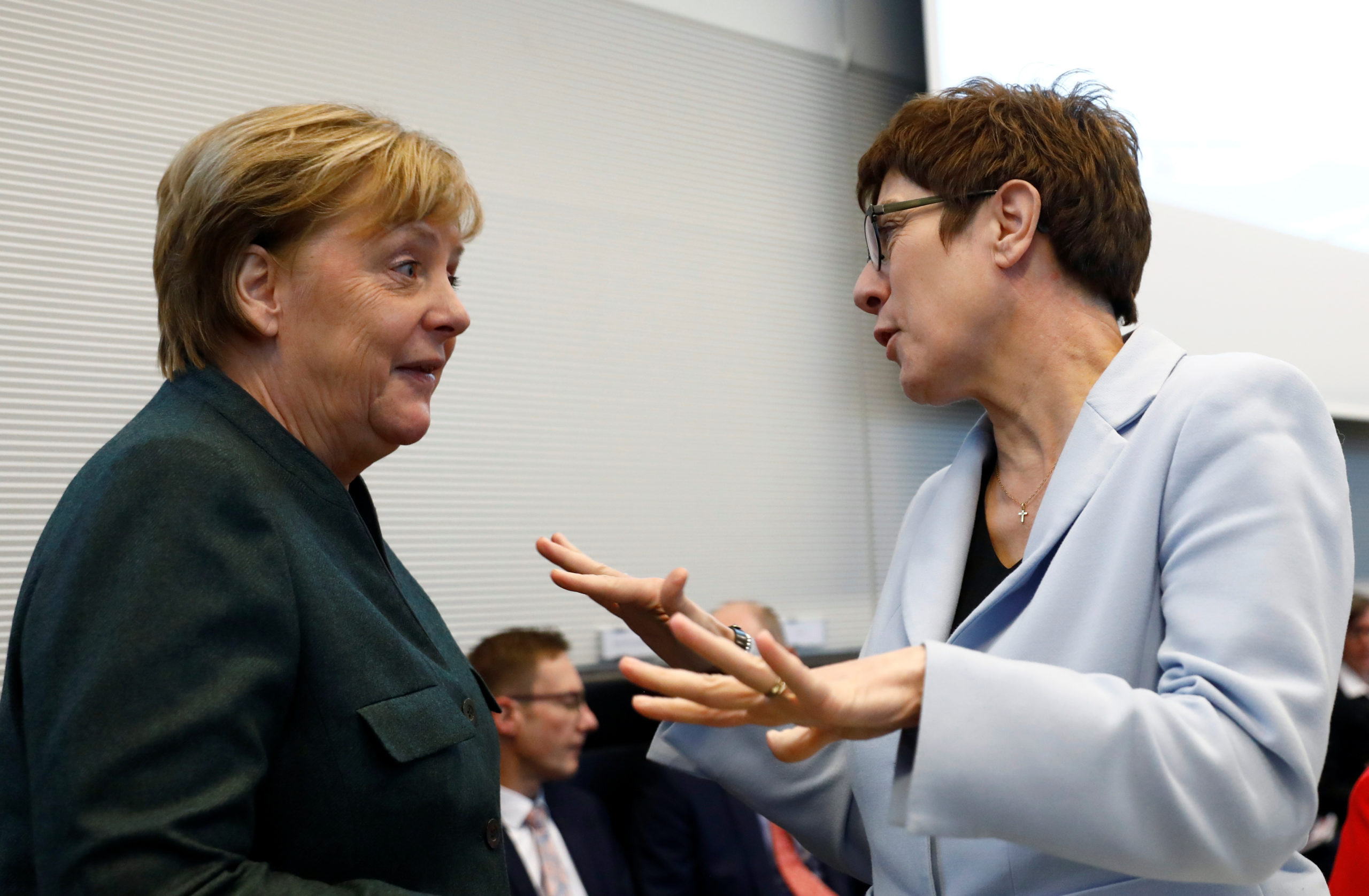 German Chancellor Angela Merkel speaks with Germany's Defense Minister Annegret Kramp-Karrenbauer during the meeting of the Christian Democratic Union's Bundestag fraction in Berlin, Germany February 11, 2020.    REUTERS