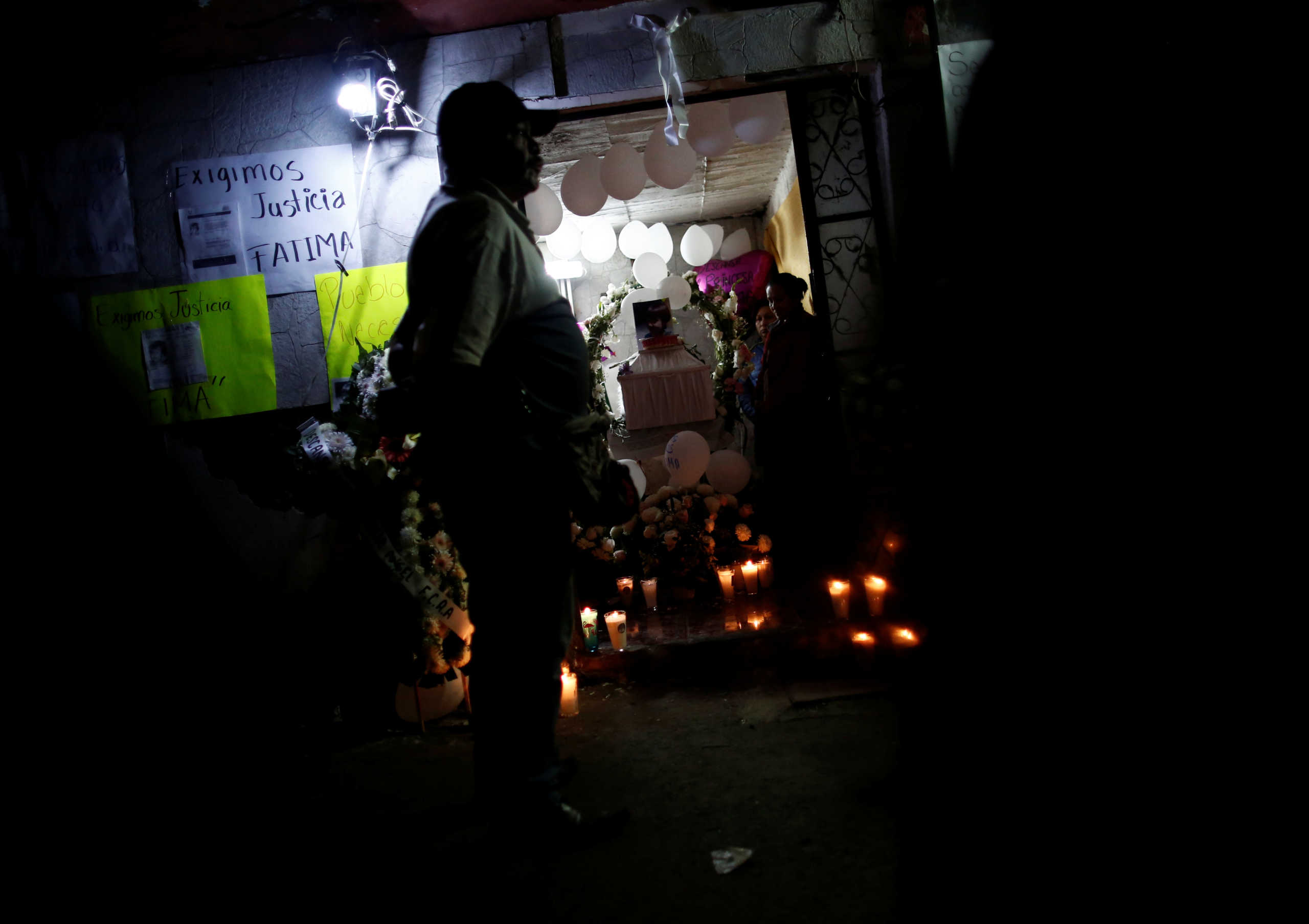People stand near the coffin of Fatima Cecilia Aldrighett, 7, who went missing on February 11 and whose body was discovered over the weekend inside a plastic garbage bag, at her house in Mexico City, Mexico, February 17, 2020. REUTERS
