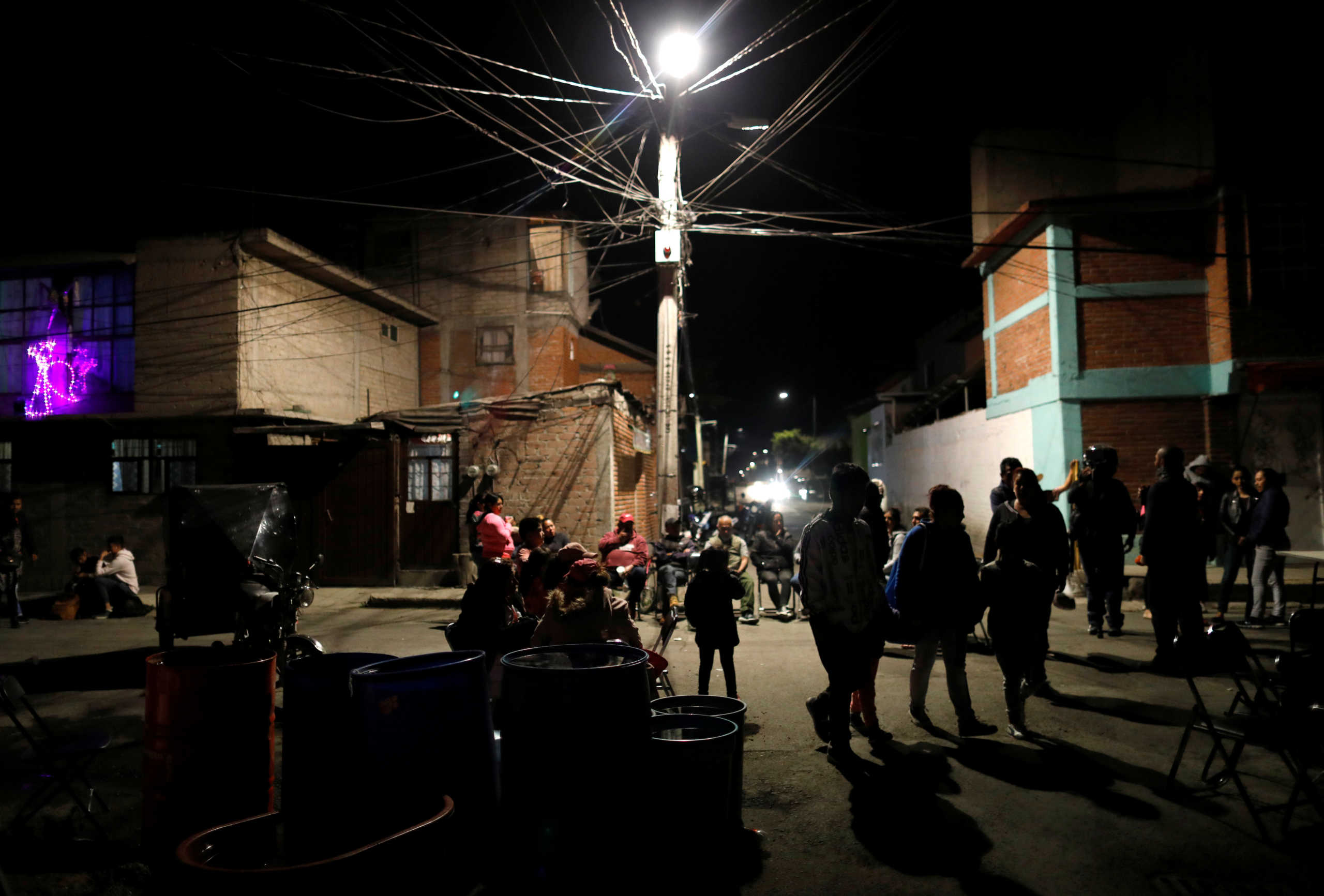 People arrive to pay their respects near the coffin of Fatima Cecilia Aldrighett, 7, who went missing on February 11 and whose body was discovered over the weekend inside a plastic garbage bag, at her house in Mexico City, Mexico, February 17, 2020. REUTERS