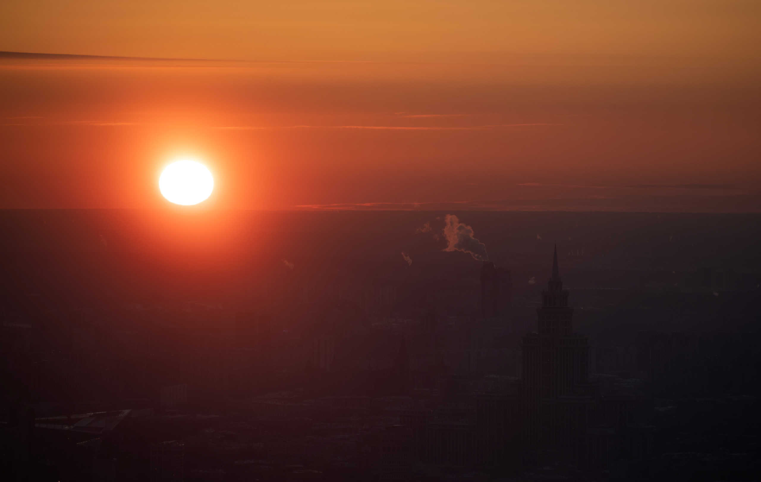 The sun sets behind apartment blocks on a frosty day in Moscow, Russia February 8, 2020. REUTERS
