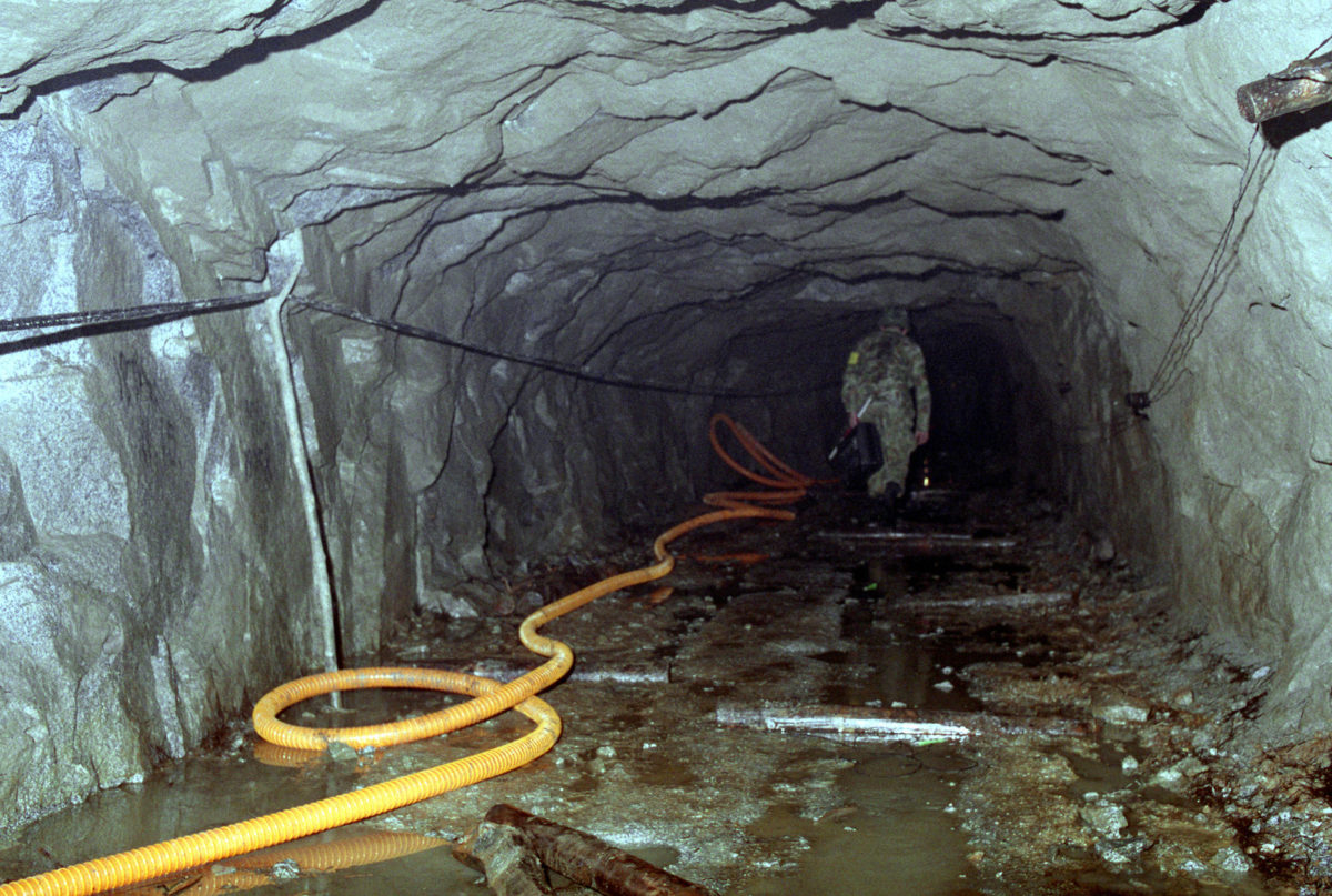 A South Korean investigation team member explores North Korean tunnel No. 4 near Kach'il-Bong Peak.  South Korean counter-tunnels are being constructed to eliminate the value of North Korean tunnels by intersecting them.
