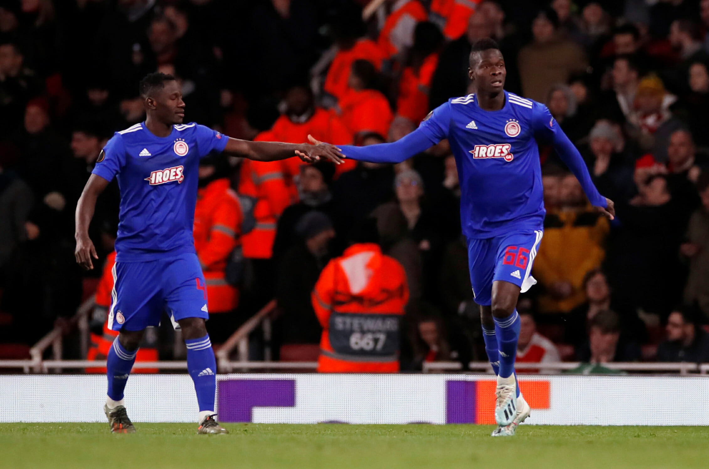 Soccer Football - Europa League - Round of 32 Second Leg - Arsenal v Olympiacos - Emirates Stadium, London, Britain - February 27, 2020  Olympiacos' Pape Abou Cisse celebrates scoring their first goal with Mohamed Camara   Action Images via Reuters