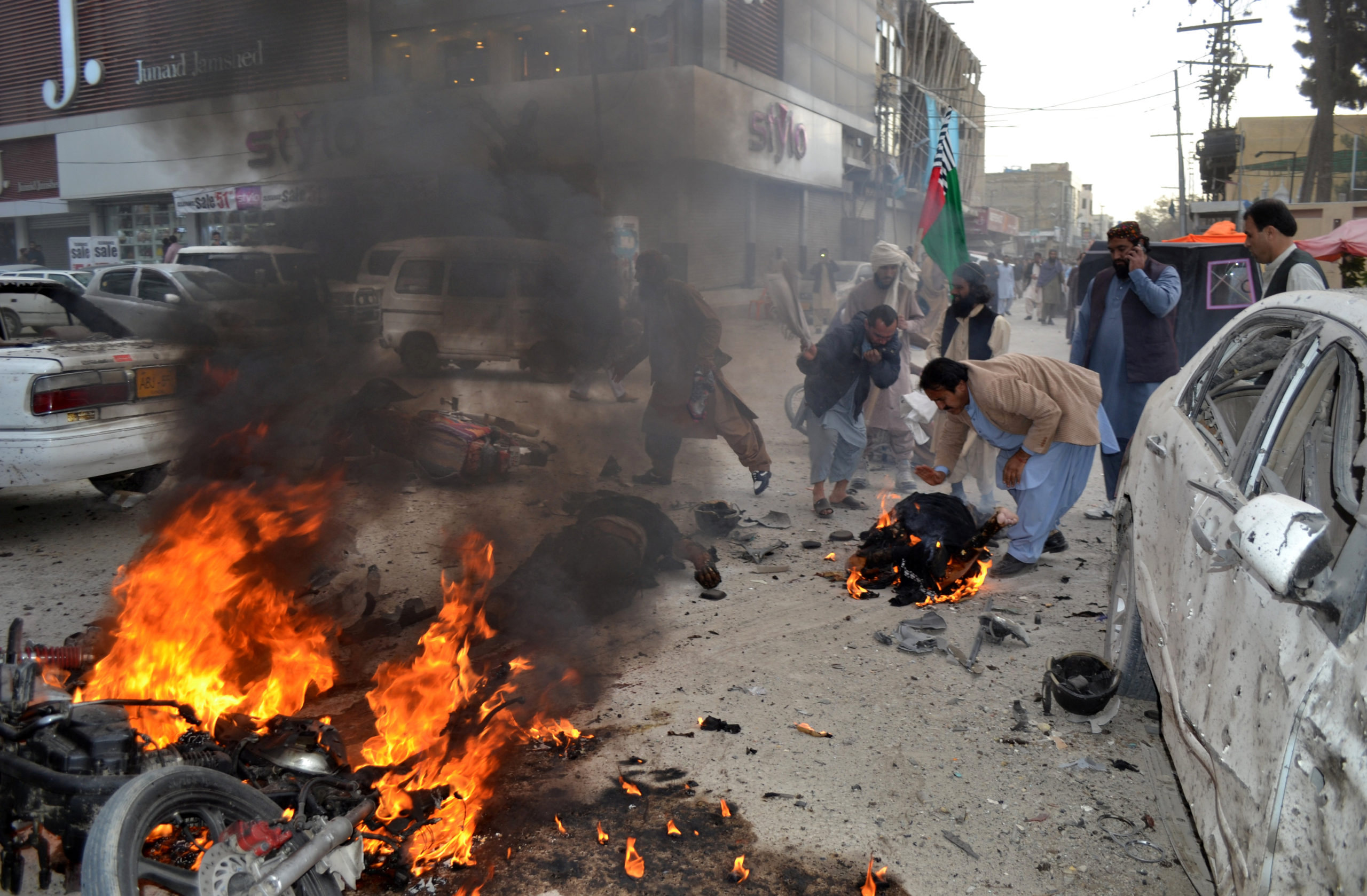 SENSITIVE MATERIAL. THIS IMAGE MAY OFFEND OR DISTURB    People rescue a man wounded and engulfed in fire after a bomb blast in Quetta, Pakistan February 17, 2020. REUTERS
