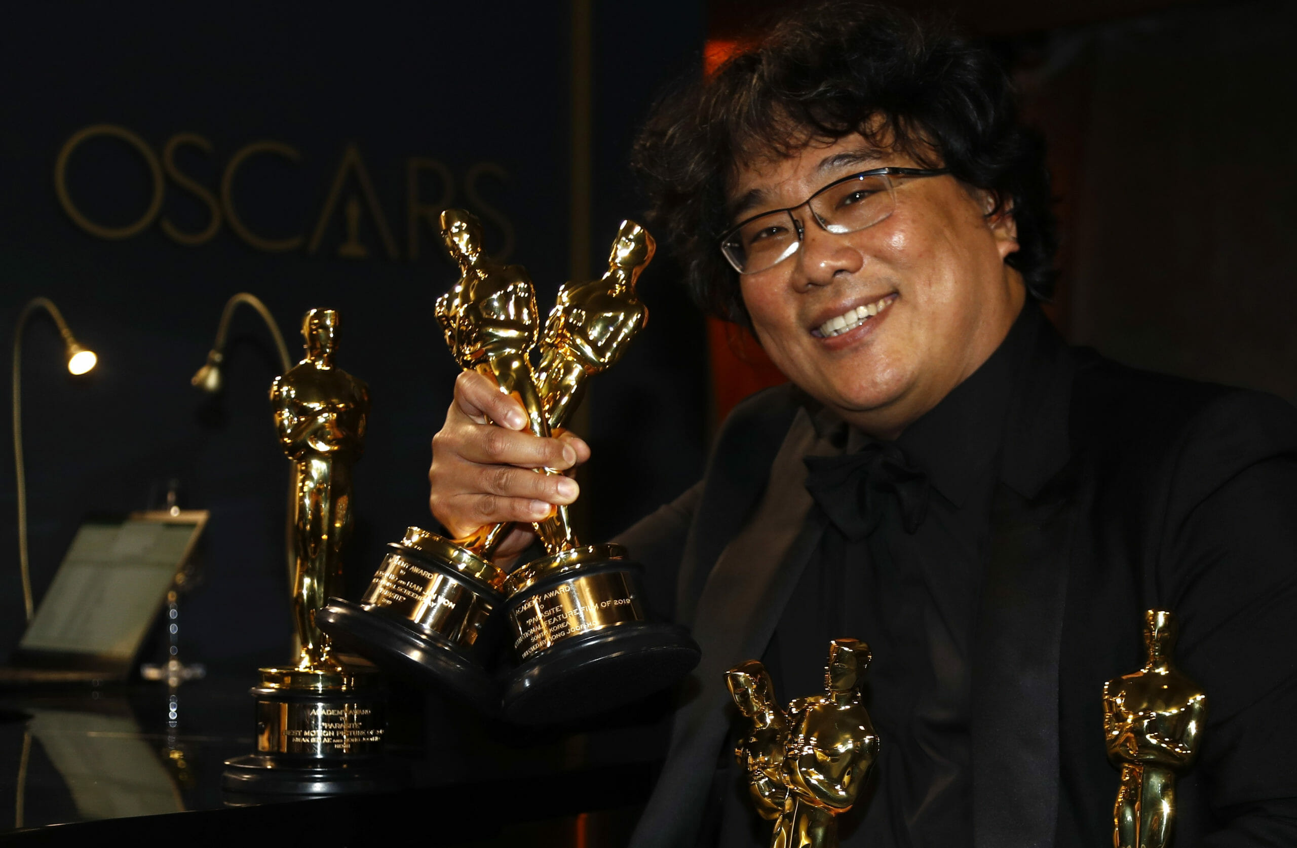 Bong Joon Ho poses with the Oscars for "Parasite" at the Governors Ball following the 92nd Academy Awards in Los Angeles, California, U.S., February 9, 2020. REUTERS