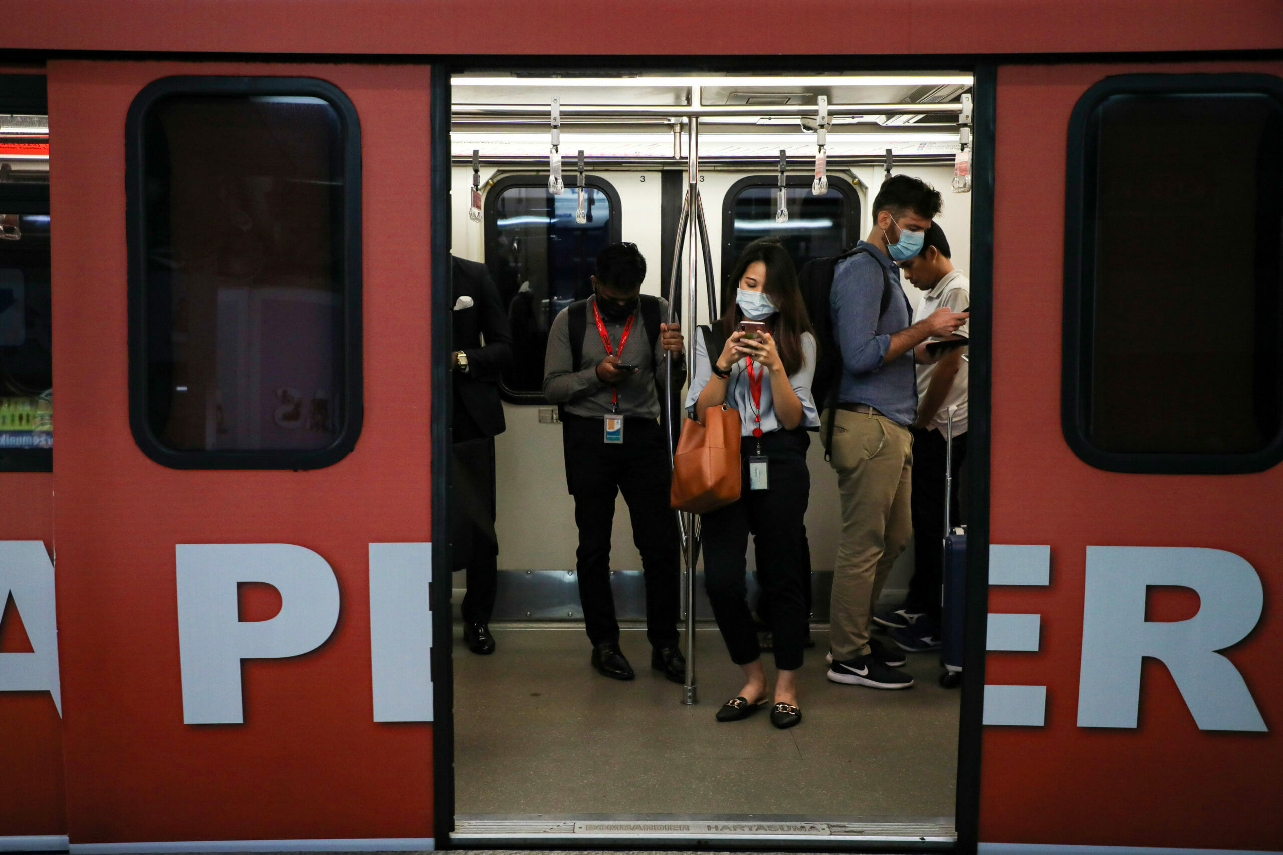 Passengers wear masks to protect themselves from coronavirus in a Light Rail Transit train in Kuala Lumpur, Malaysia, February 10, 2020. REUTERS